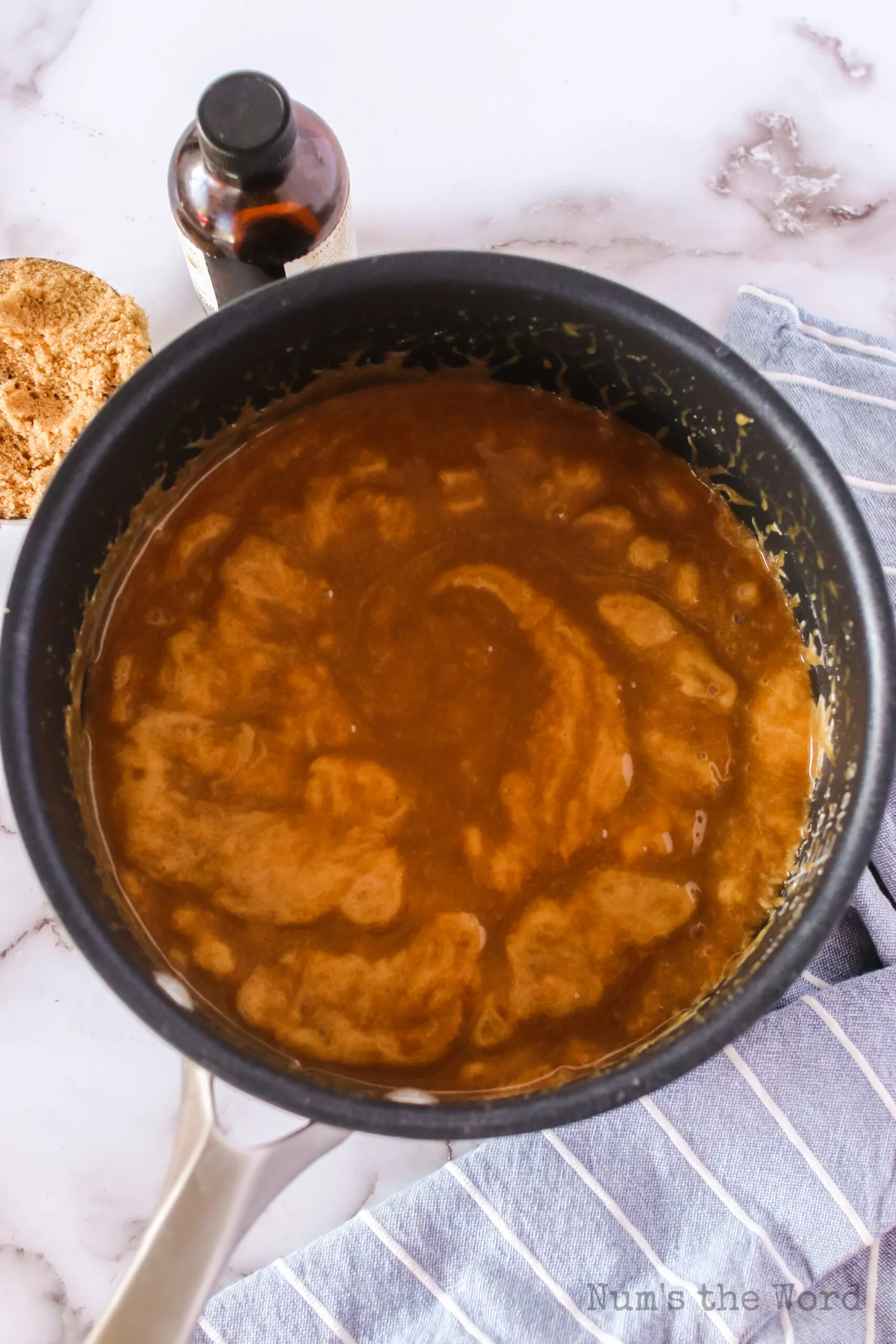 foamy caramel sauce in pot, ready to pour over popcorn