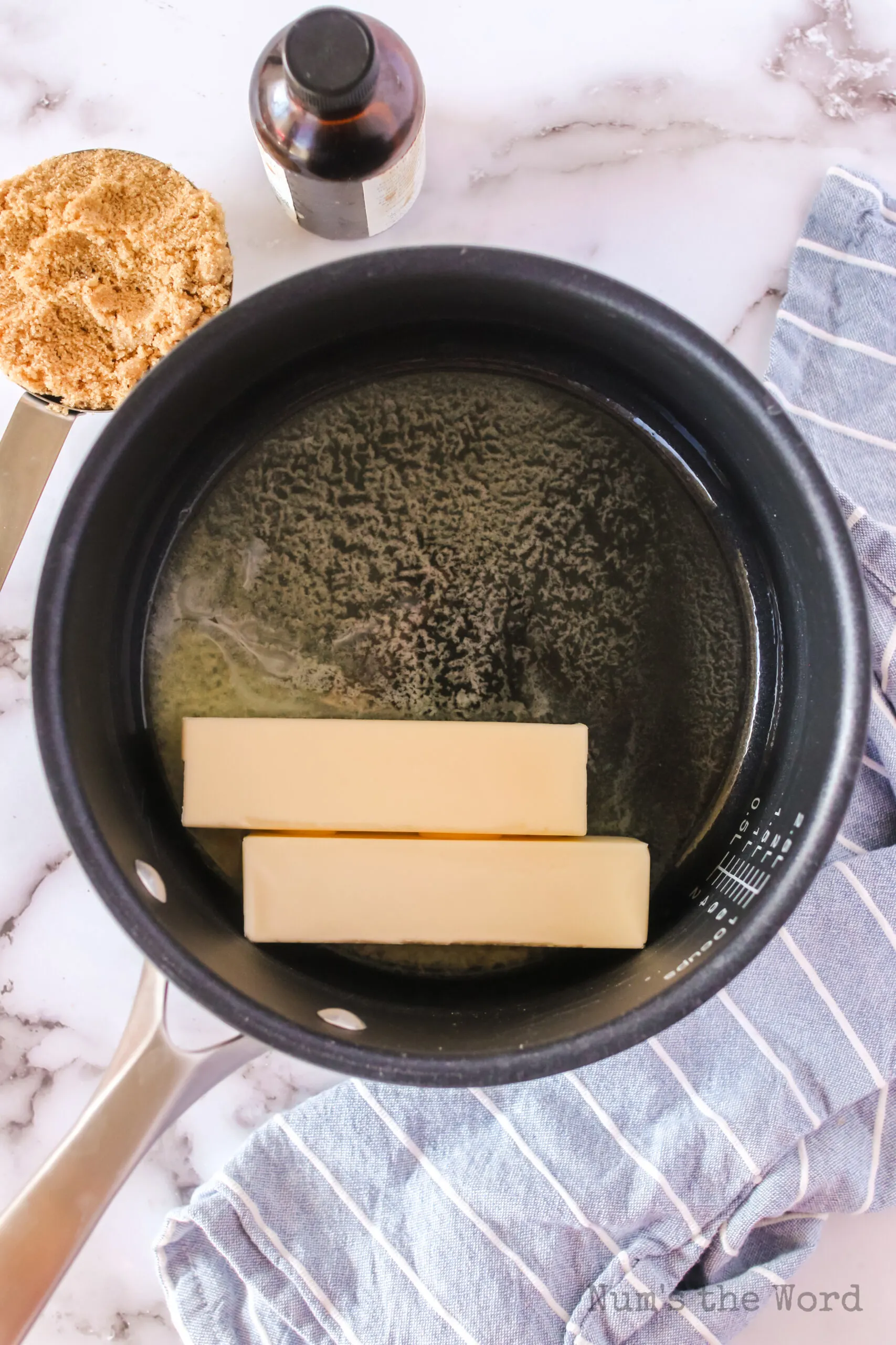 butter sticks in a pot, ready to melt