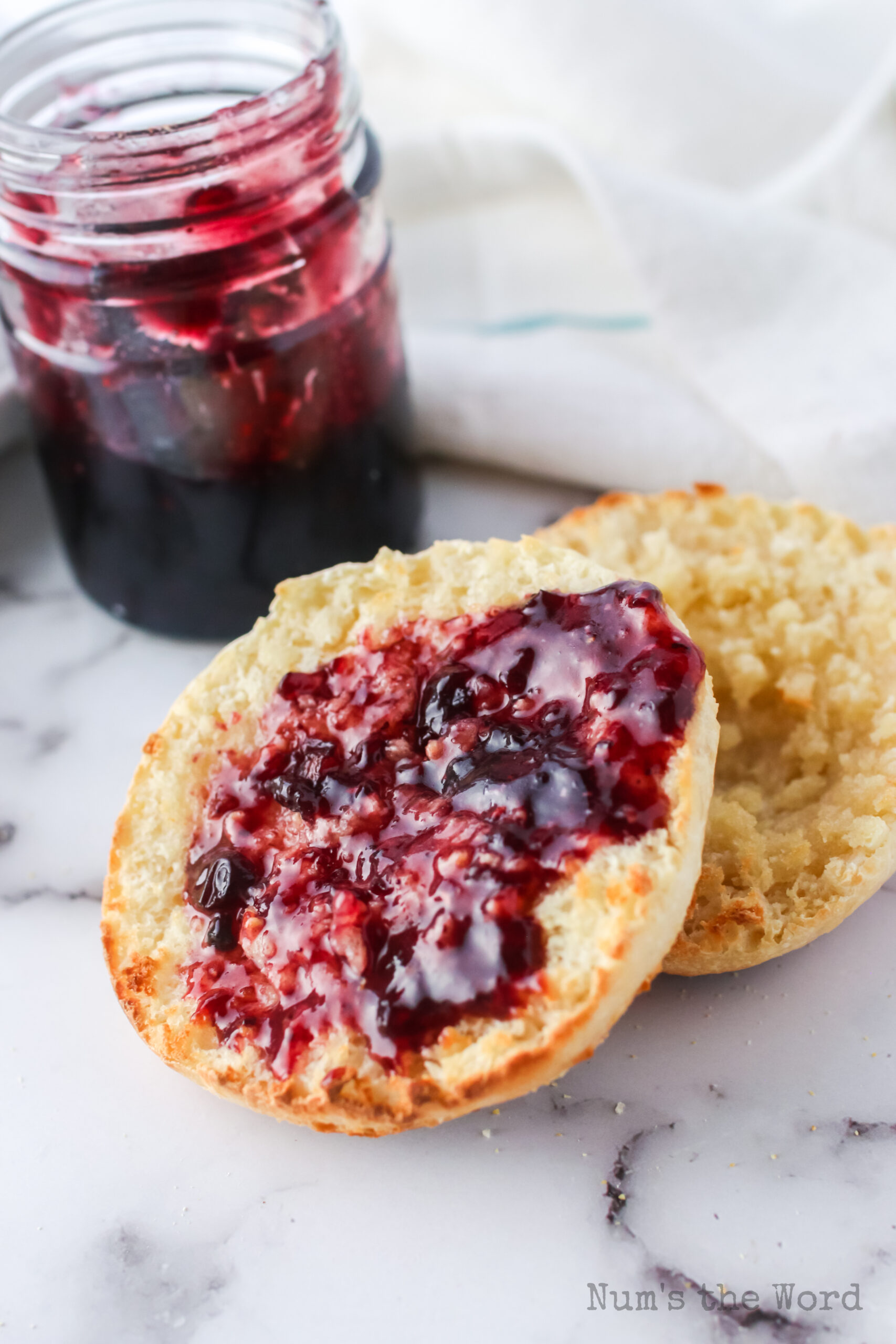 toasted english muffin with jam.