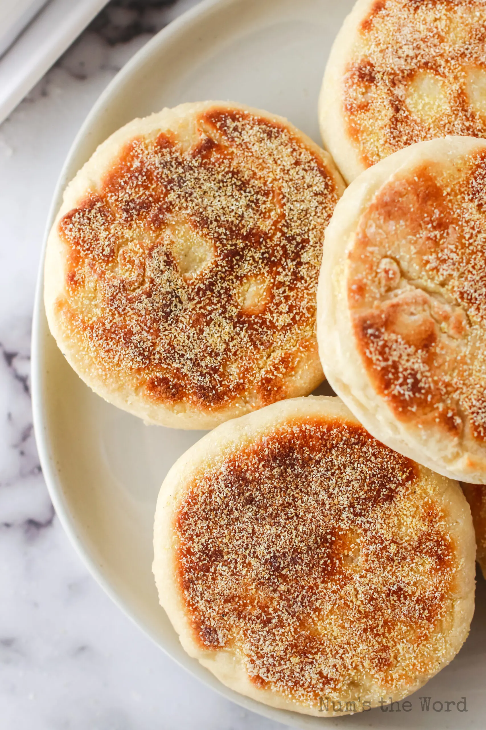 zoomed in image of english muffins on a plate