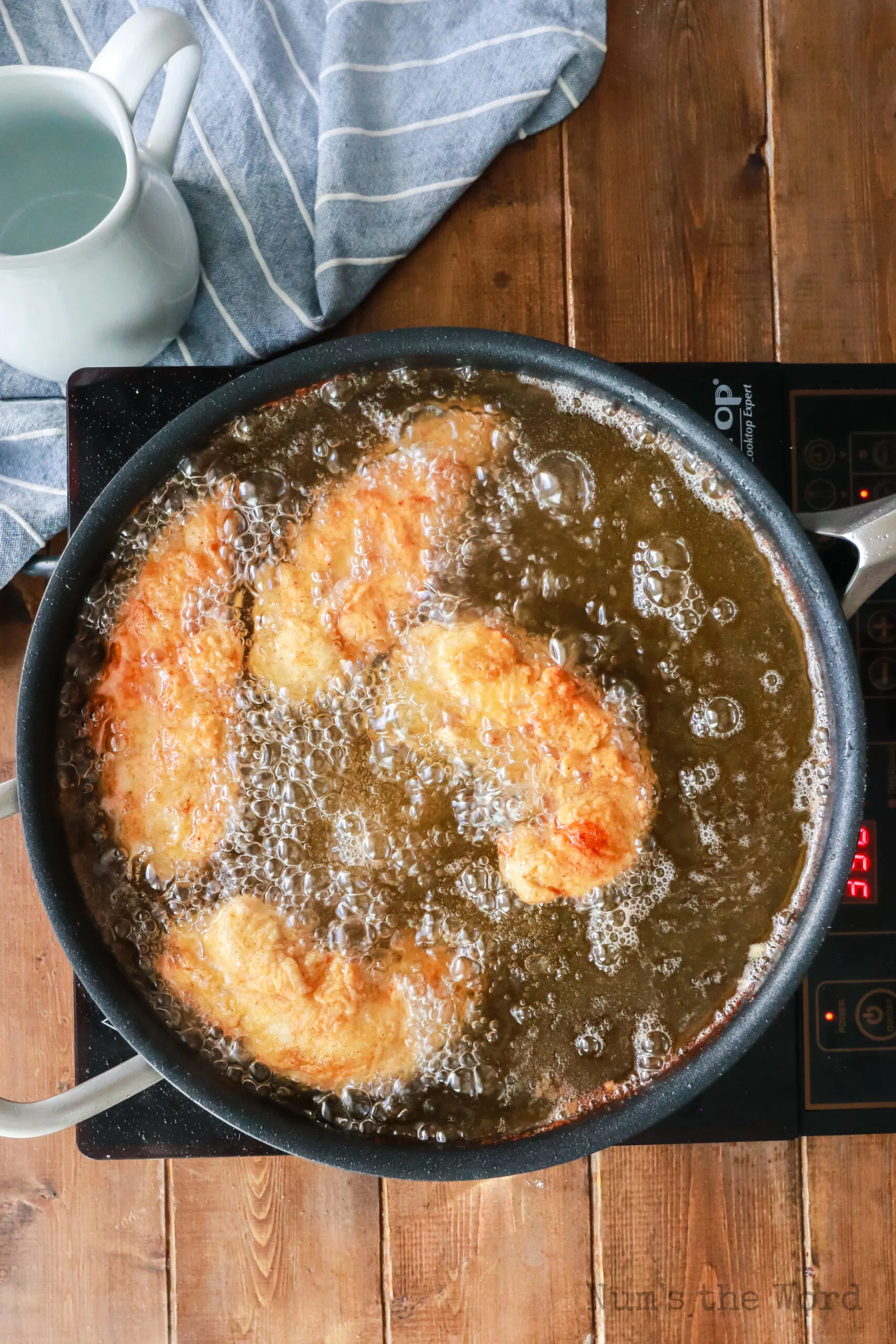 chicken in oil, golden and ready to remove from oil.