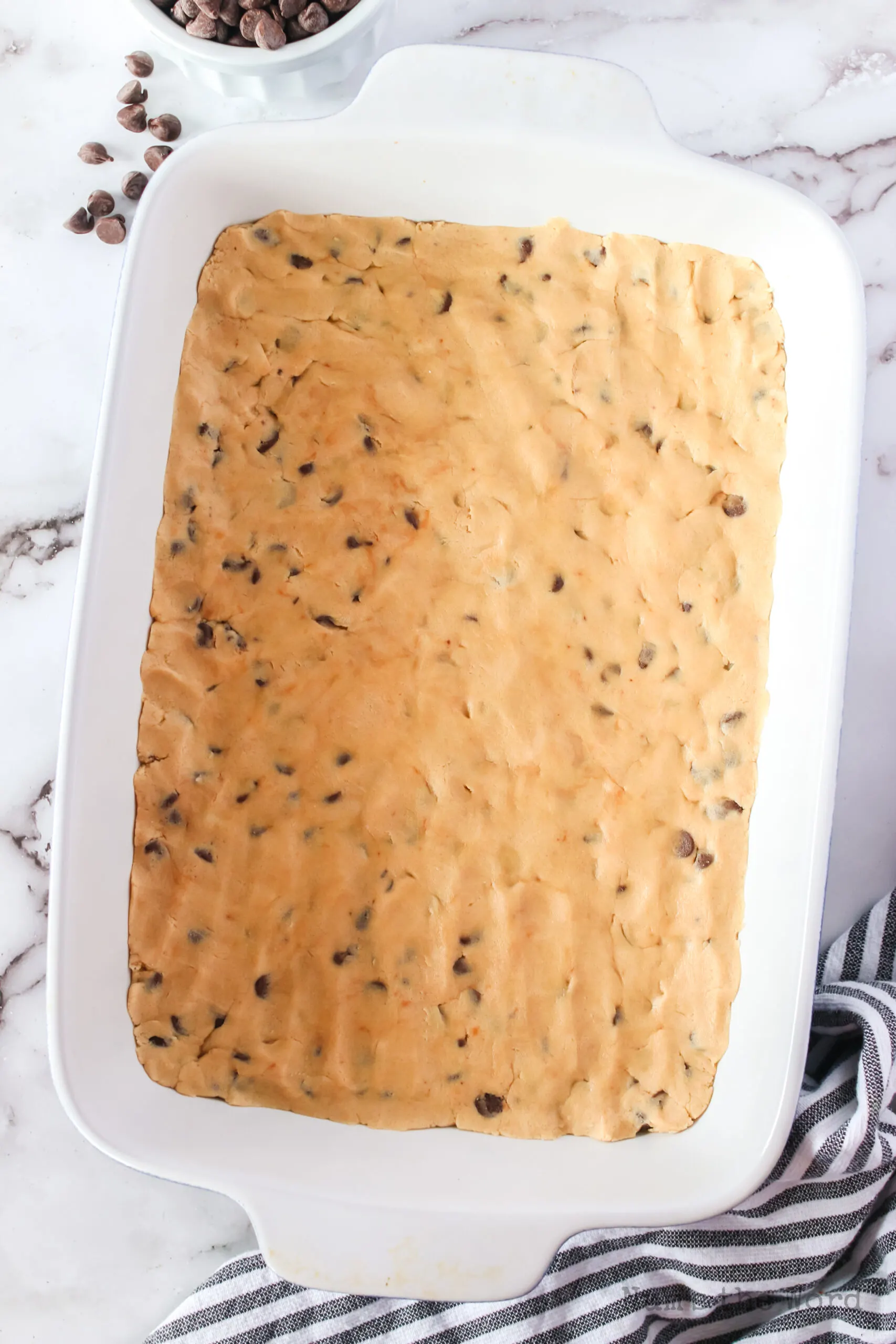 cookie dough pressed into a casserole dish