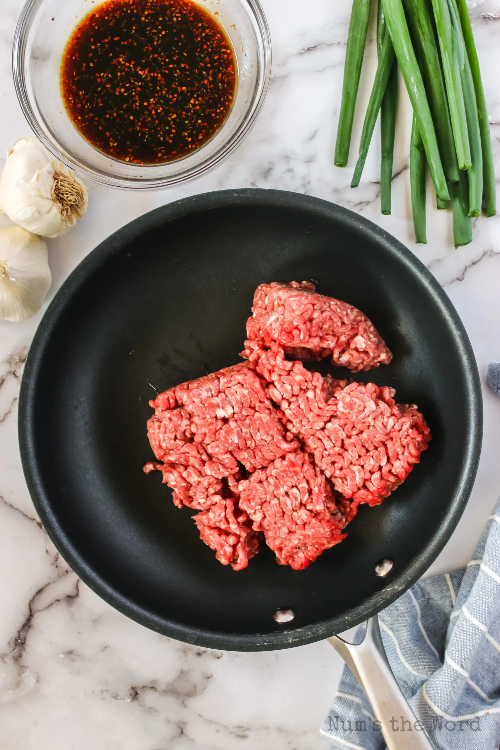 ground beef added to skillet