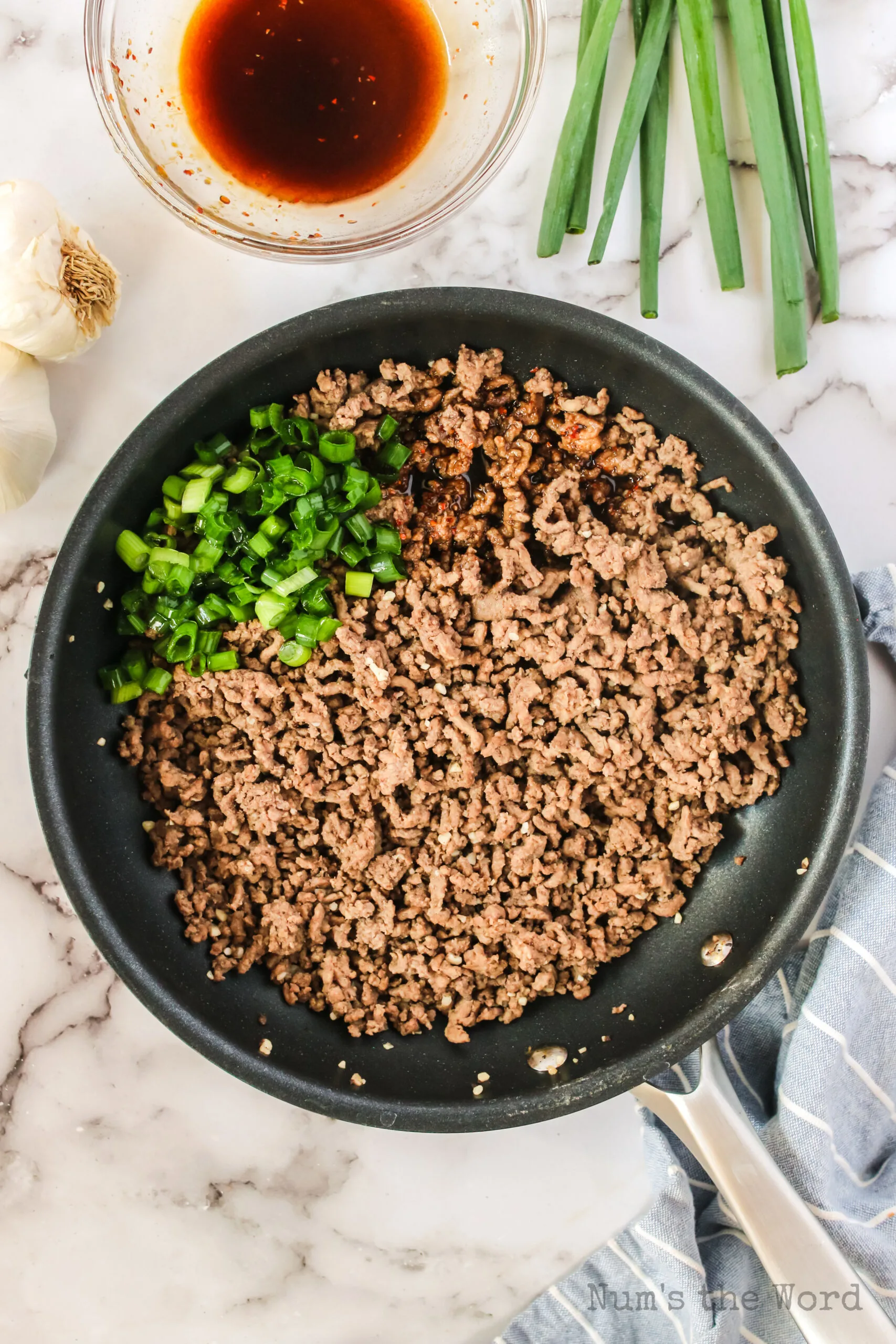 soy sauce mixture and green onions added to beef