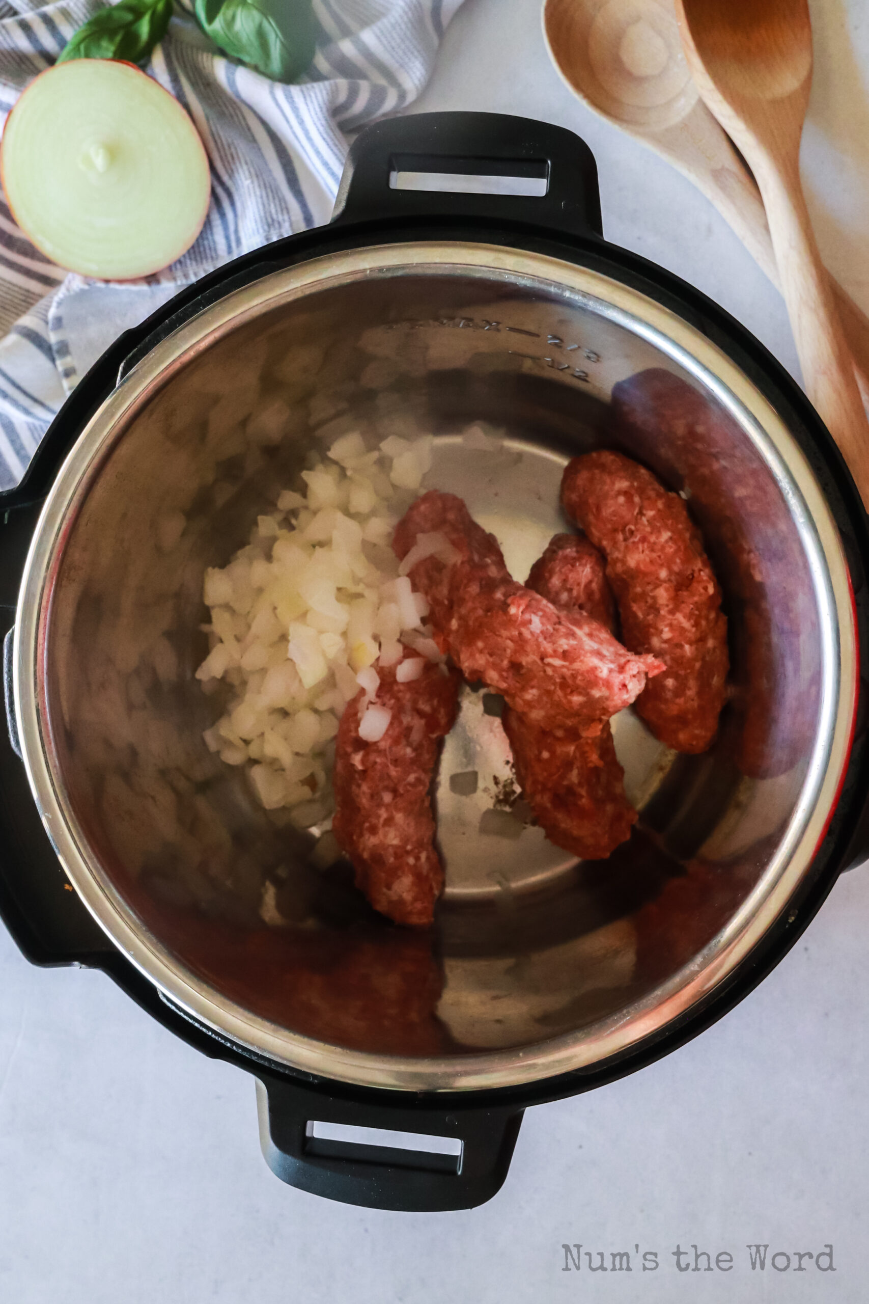 sausage and onions added to hot instant pot.