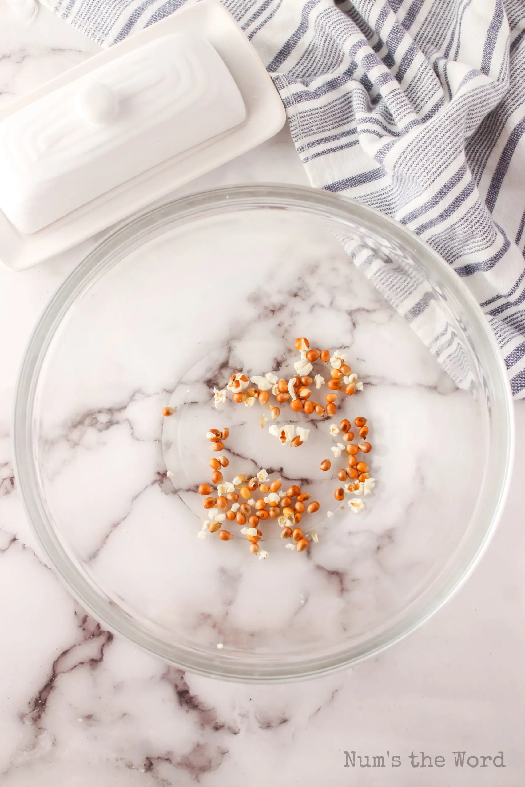 unpopped kernels in a bowl, removed from popped popcorn