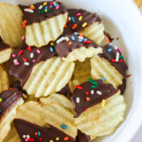 close up of chips in a bowl with chocolate and colored sprinkles