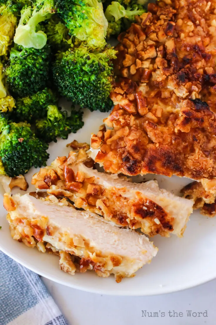 close up of chicken on a plate and sliced. Photo taken from the top looking down.