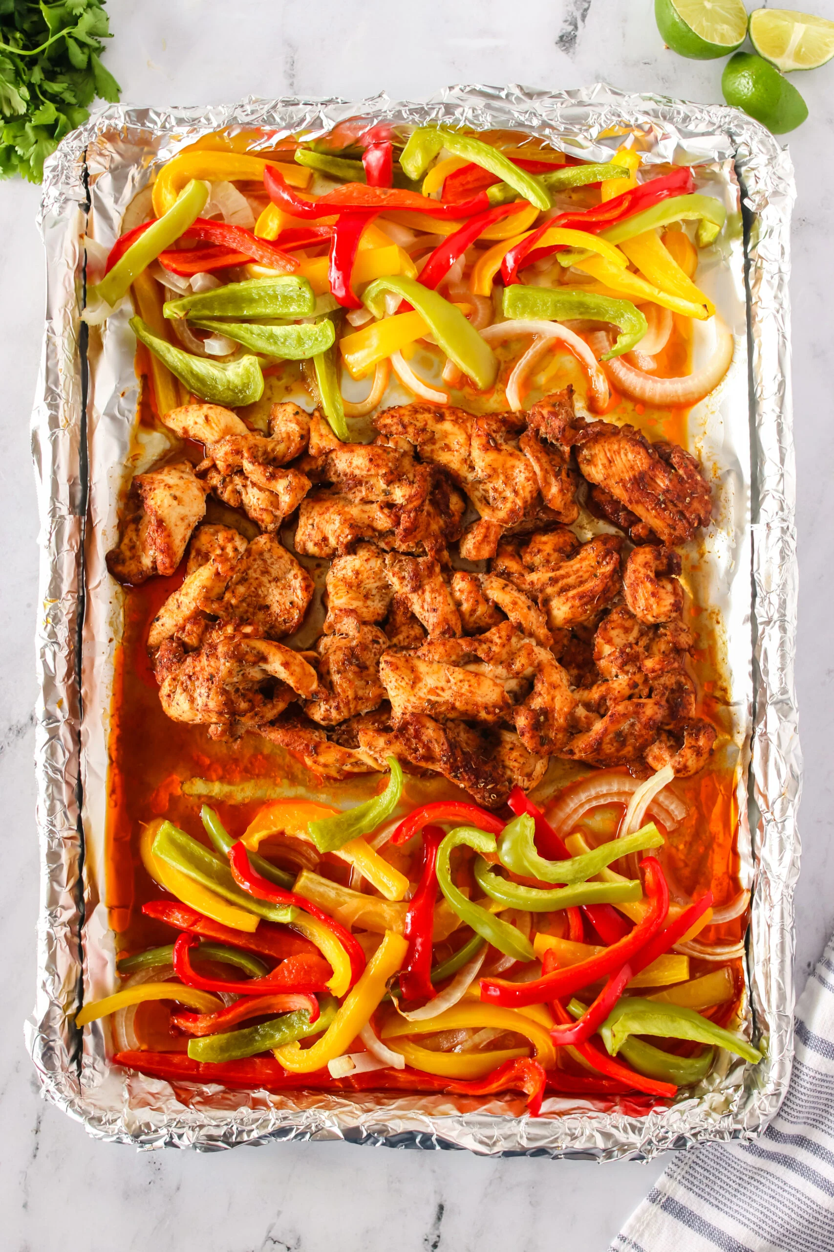 fresh cooked fajitas on a sheet pan