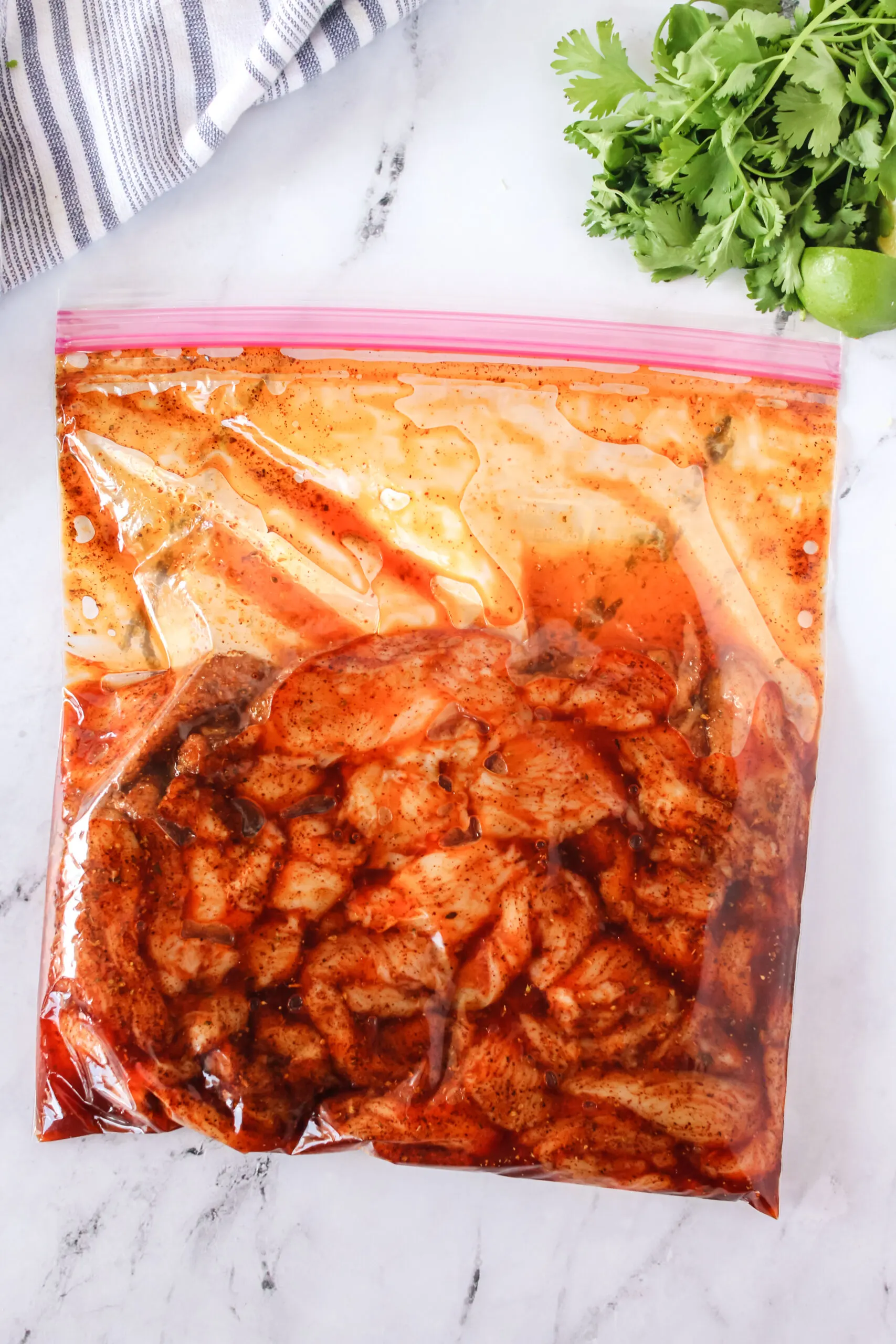 marinade poured over chicken in zipper bag