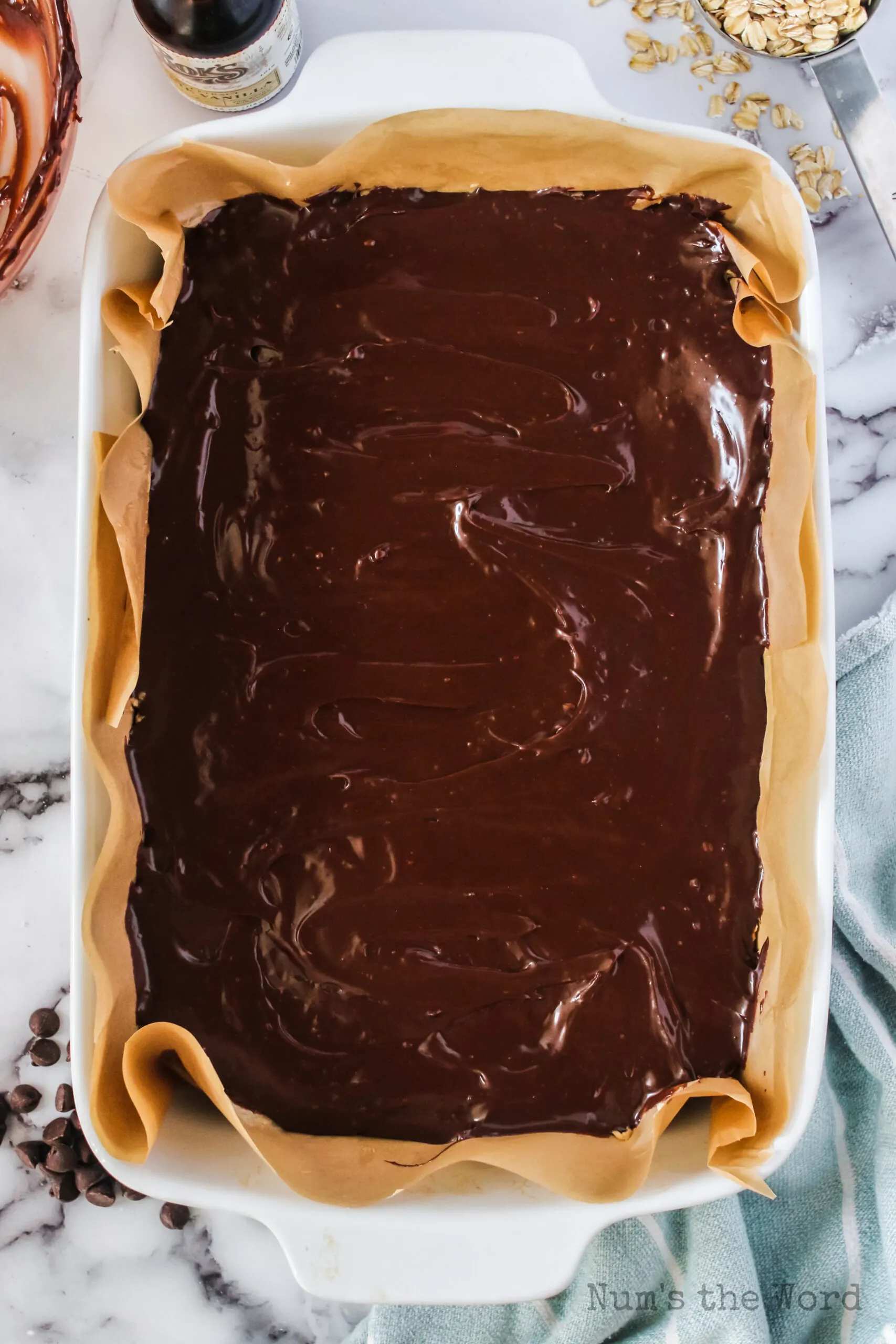 Fudge layer placed on top of oatmeal layer