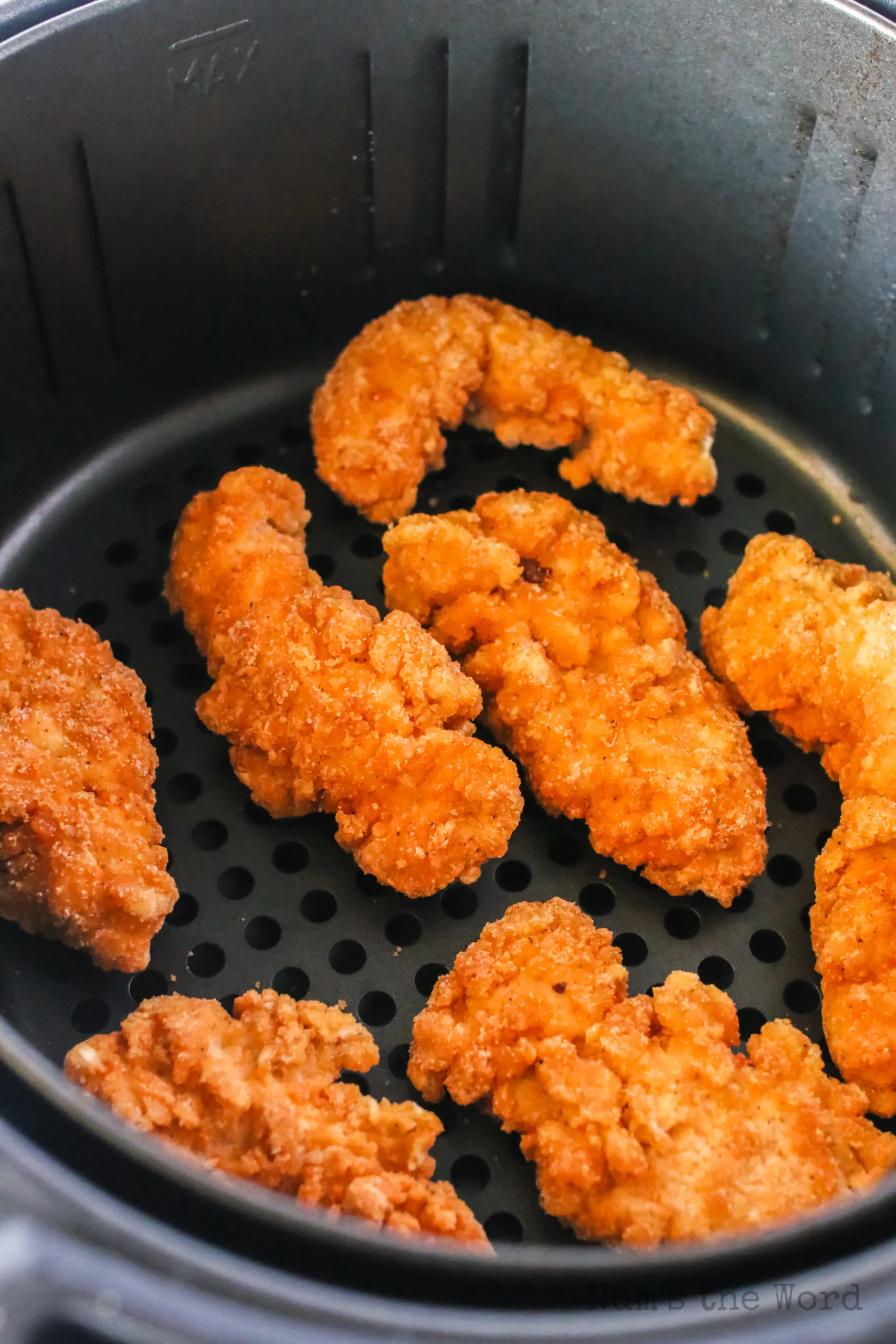 frozen strips in an air fryer basket