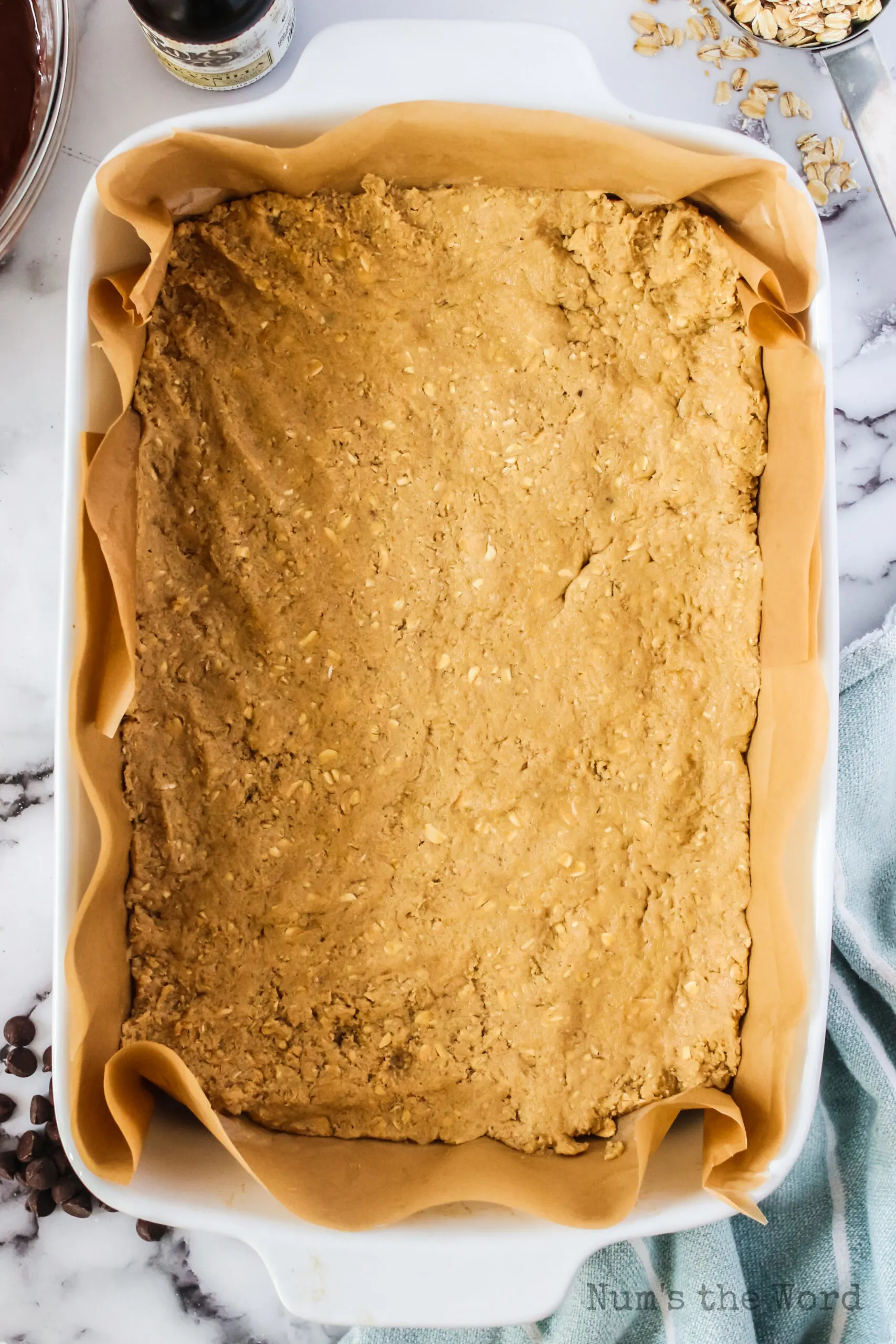 oatmeal cookie dough pressed into a casserole dish