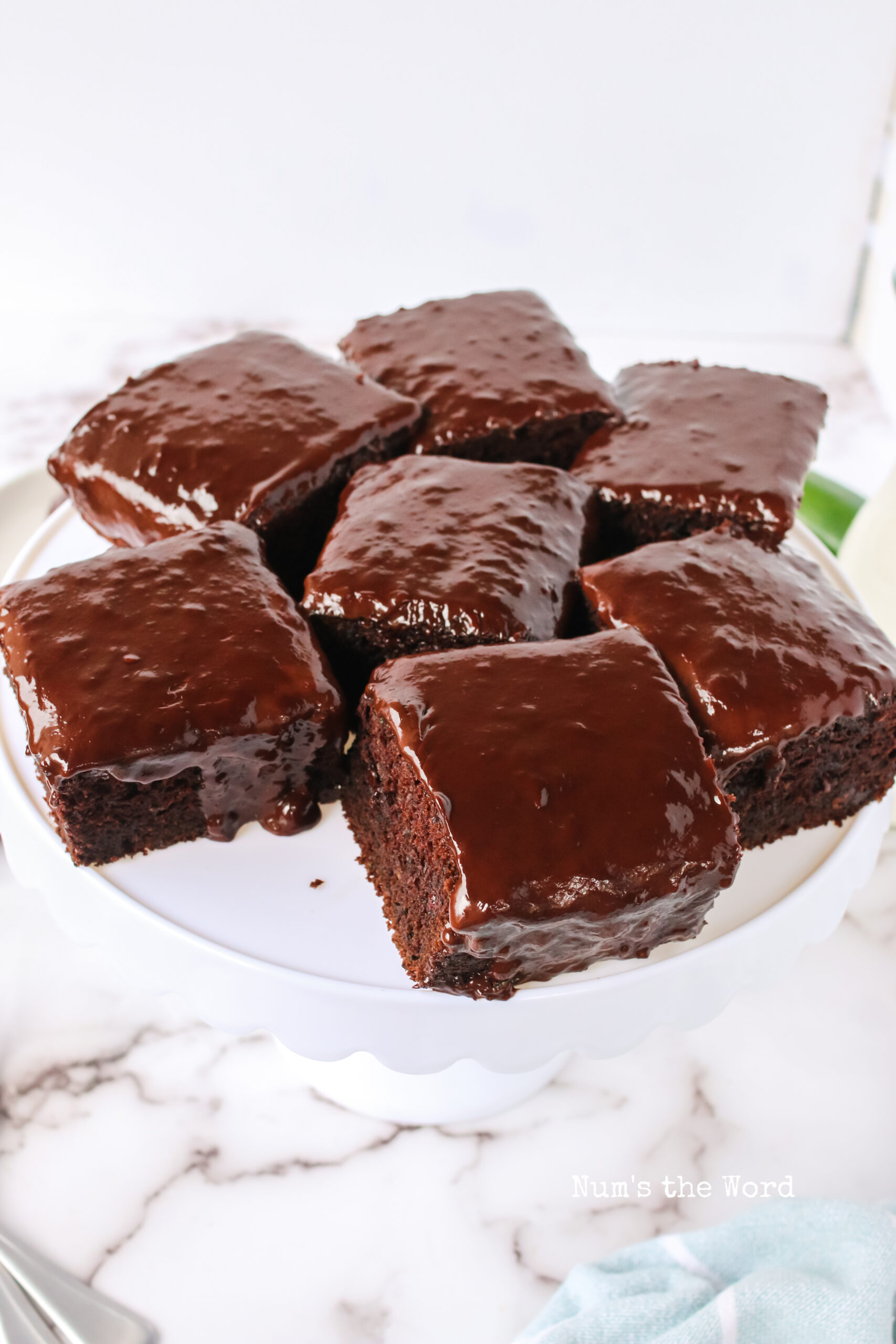 side view of chocolate cake slices on cake stand