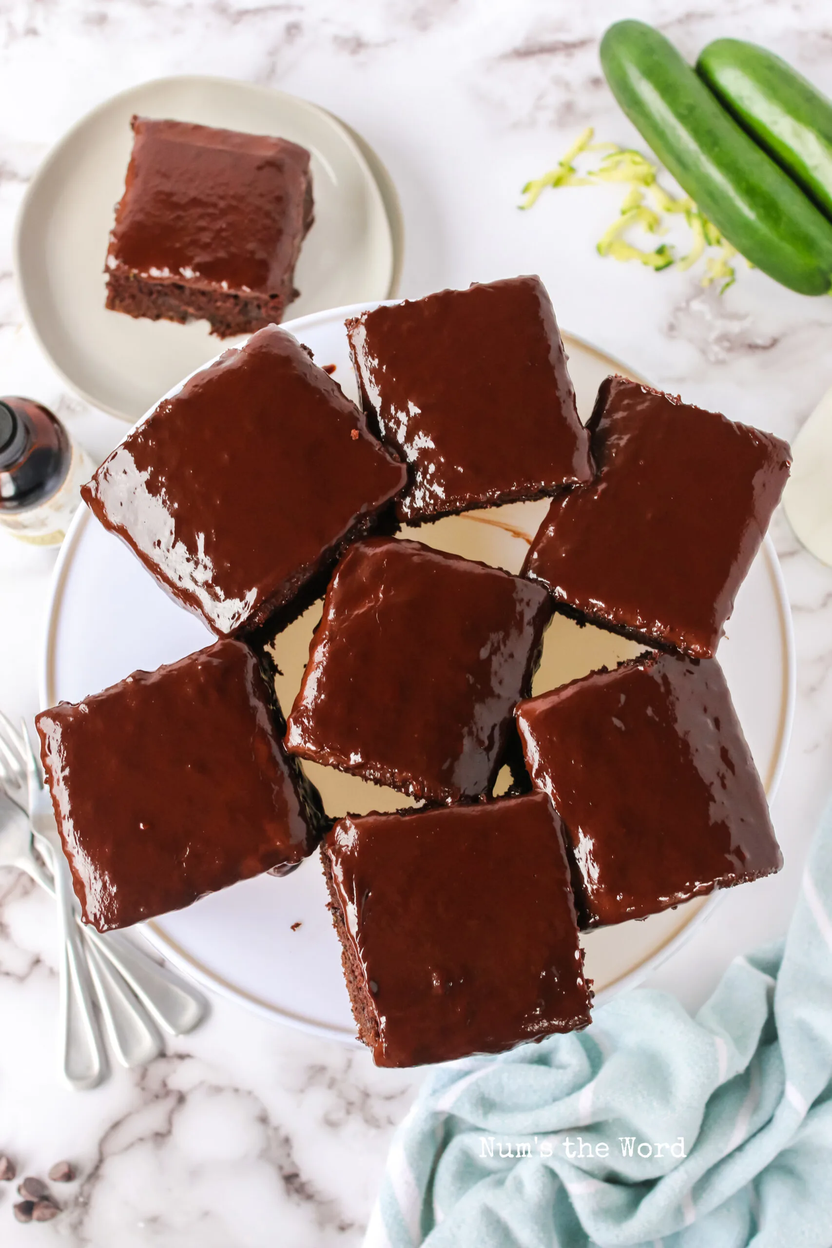 slices of chocolate zucchini cake on a cake platter and ready to serve