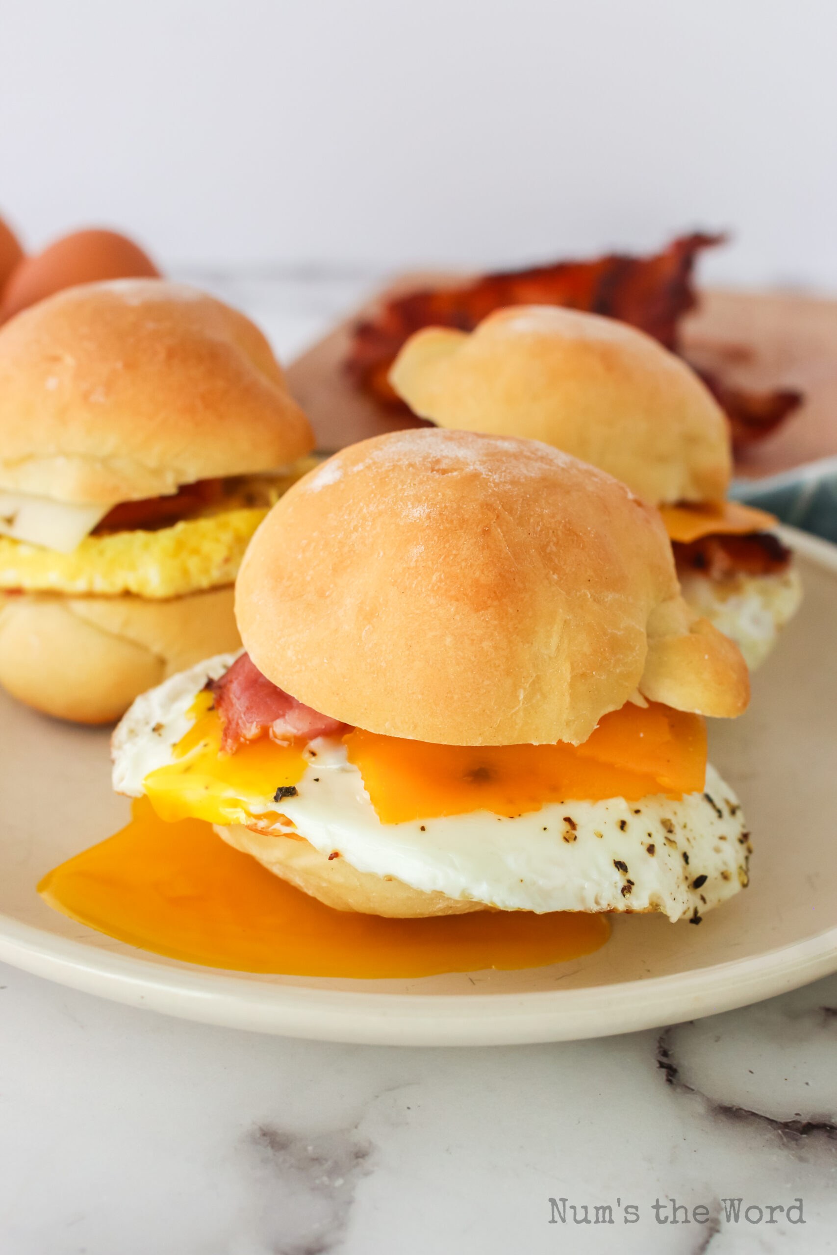 breakfast sandwich with poached egg running