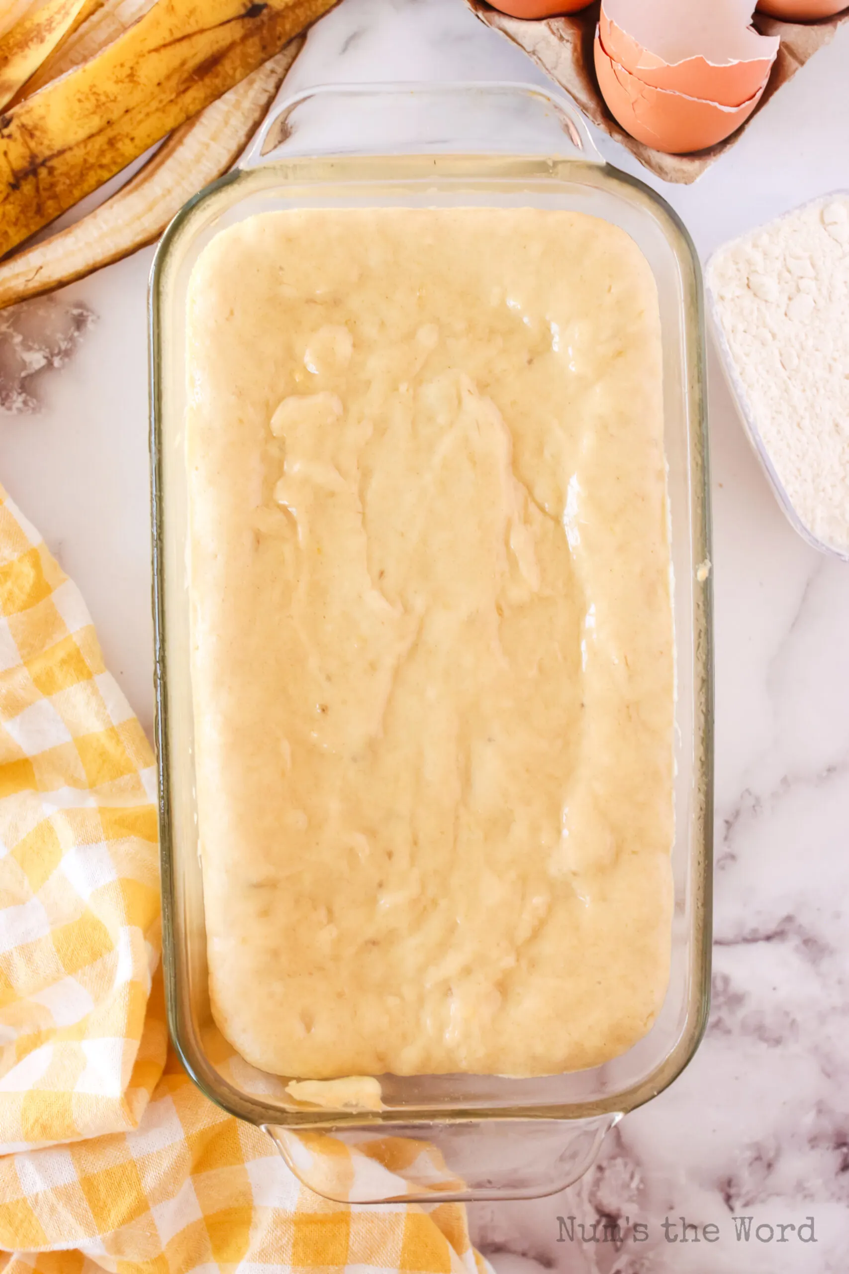 banana bread batter poured into a bread pan