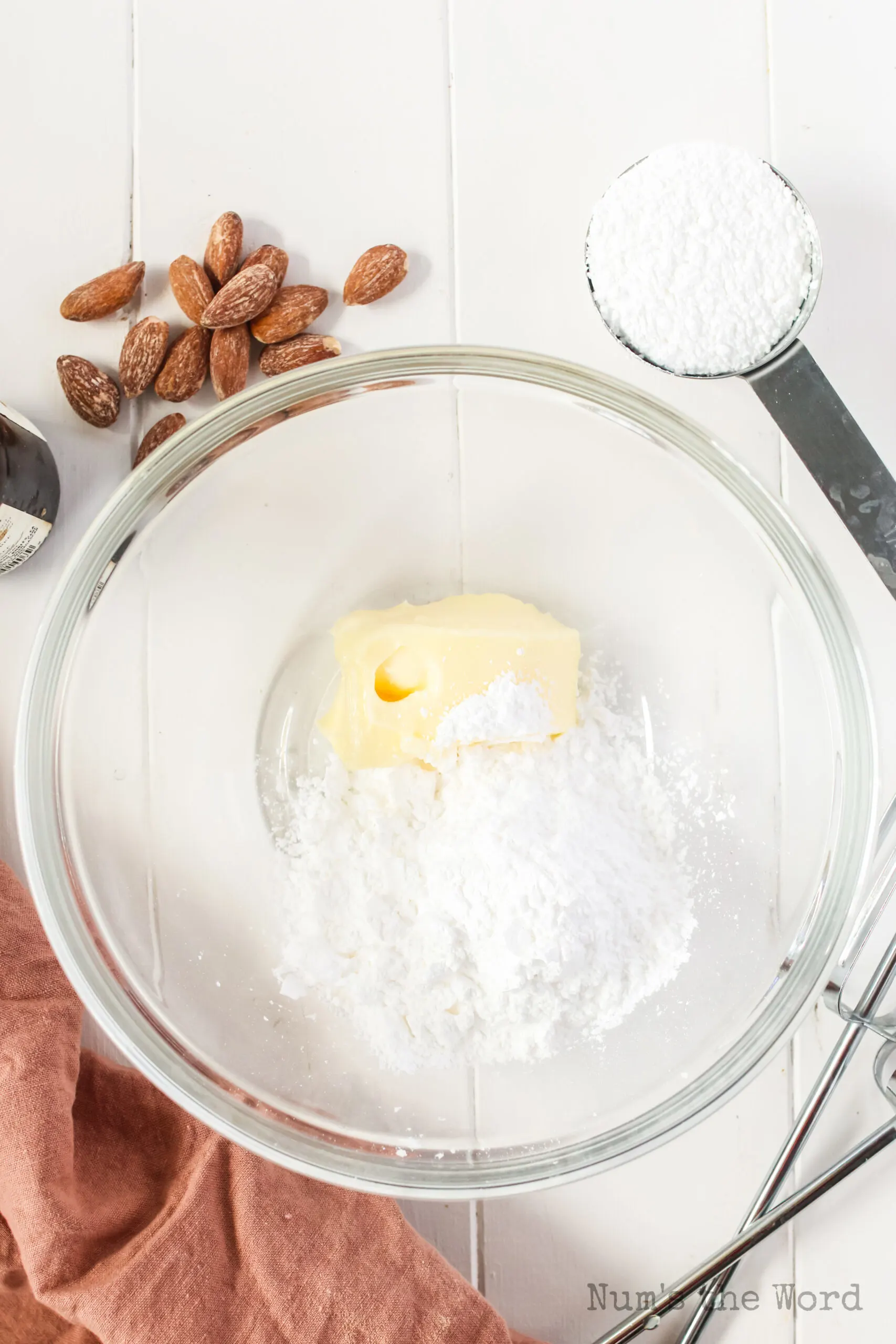 butter and powdered sugar in a bowl unmixed