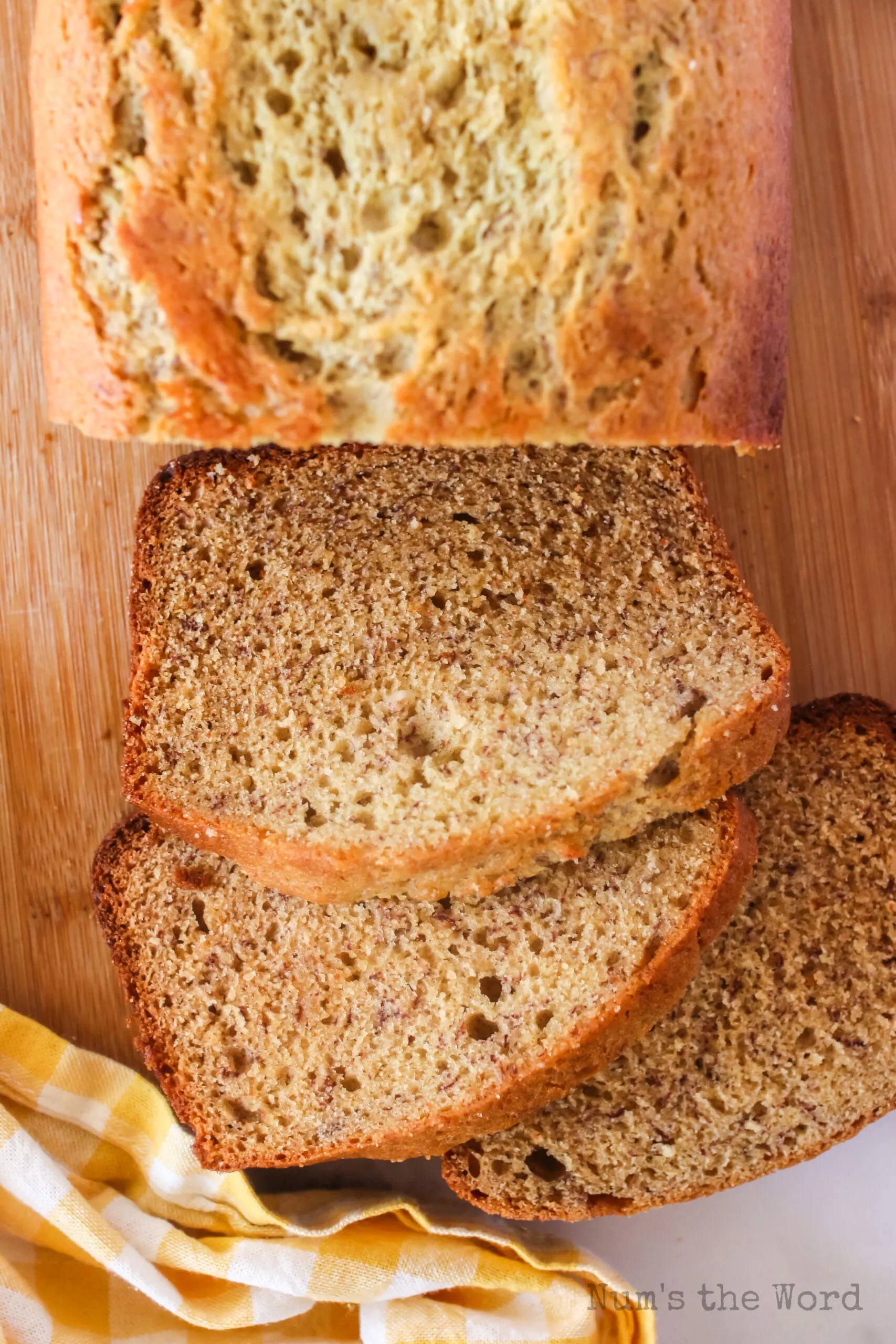 top view looking down of 3 slices of bread freshly cut on board