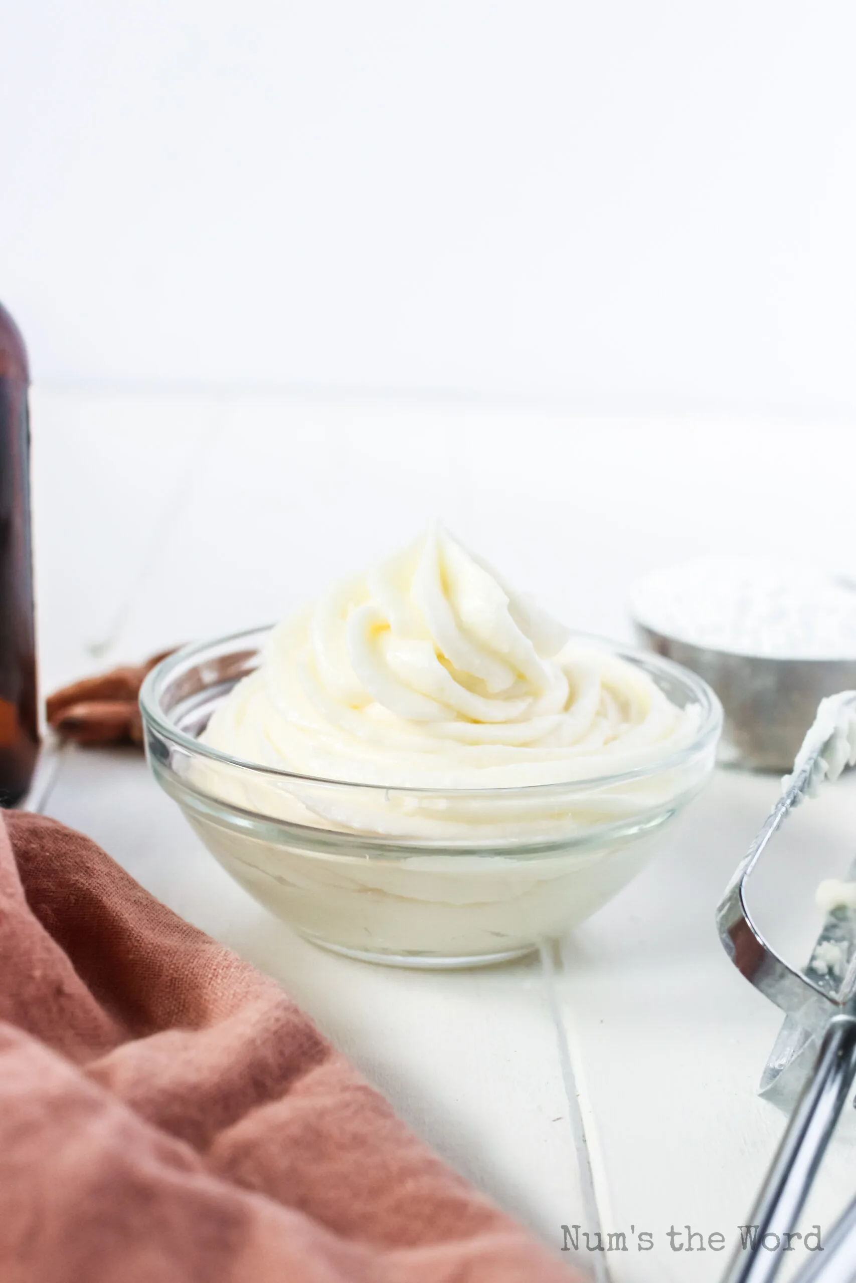 piped almond frosting in a bowl