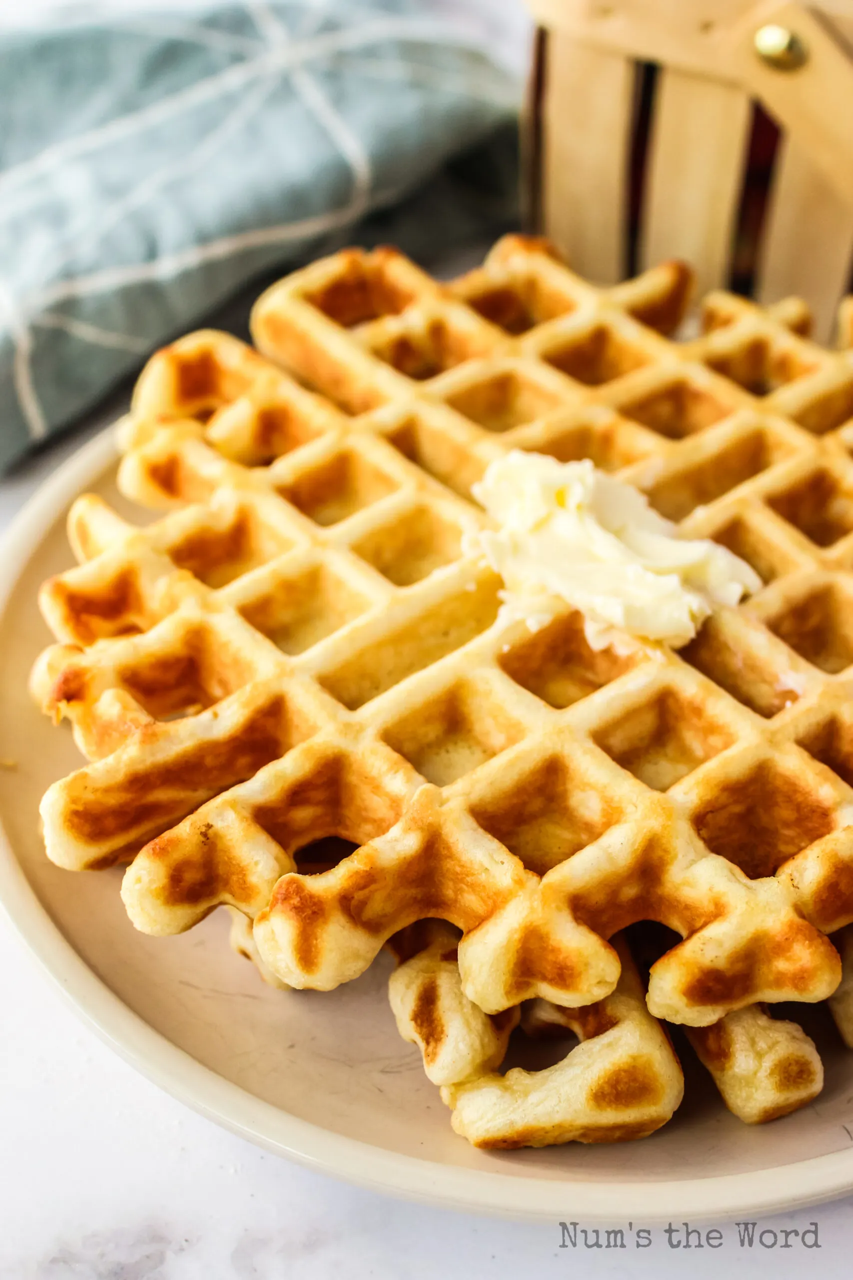 butter added to the top of a waffle