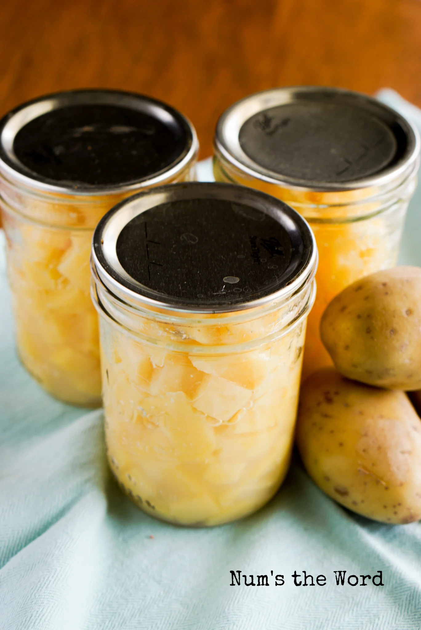 3 pint jars with diced potatoes after canning