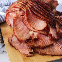 zoomed out image of cranberry ham on cutting board