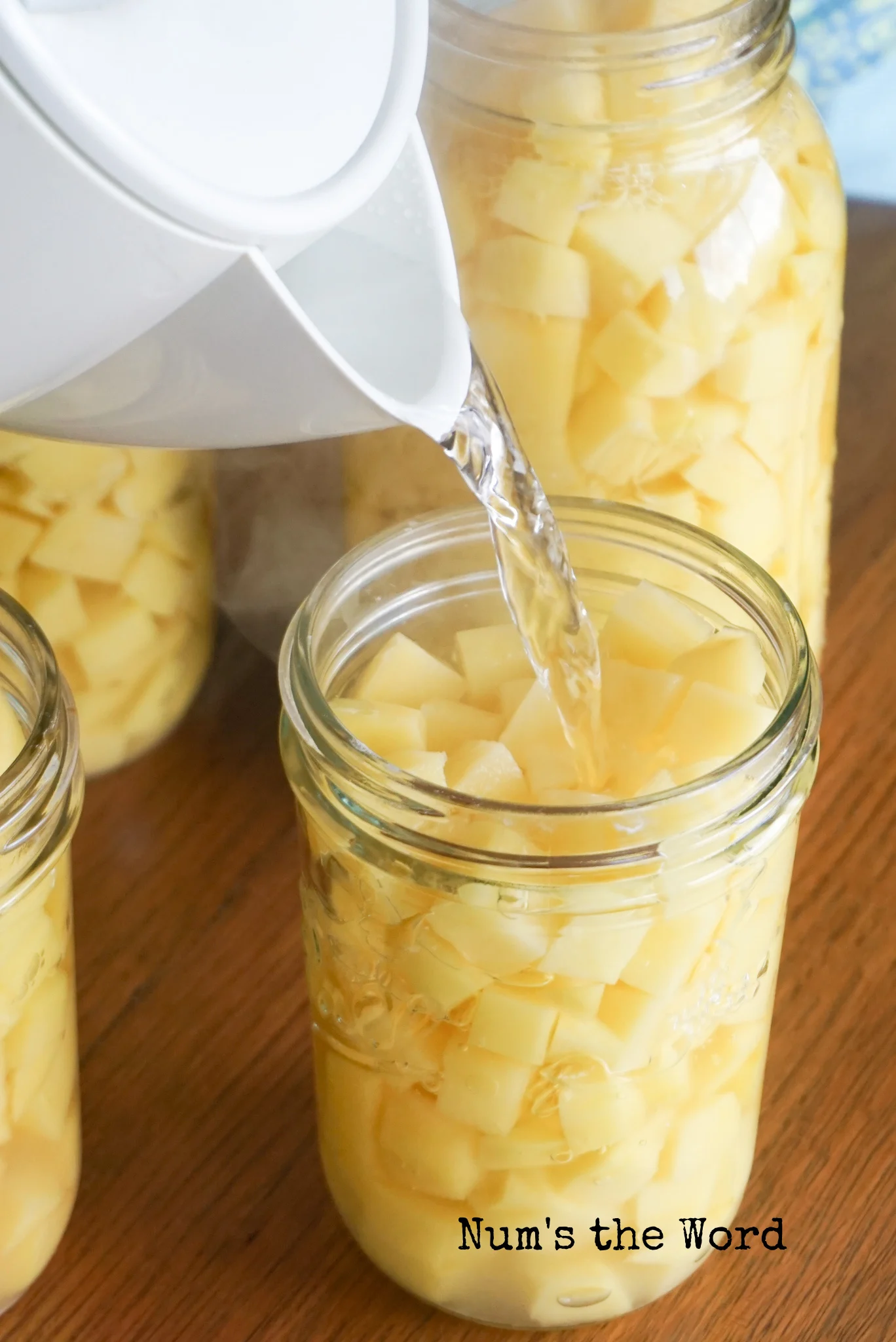 water being poured into each jar