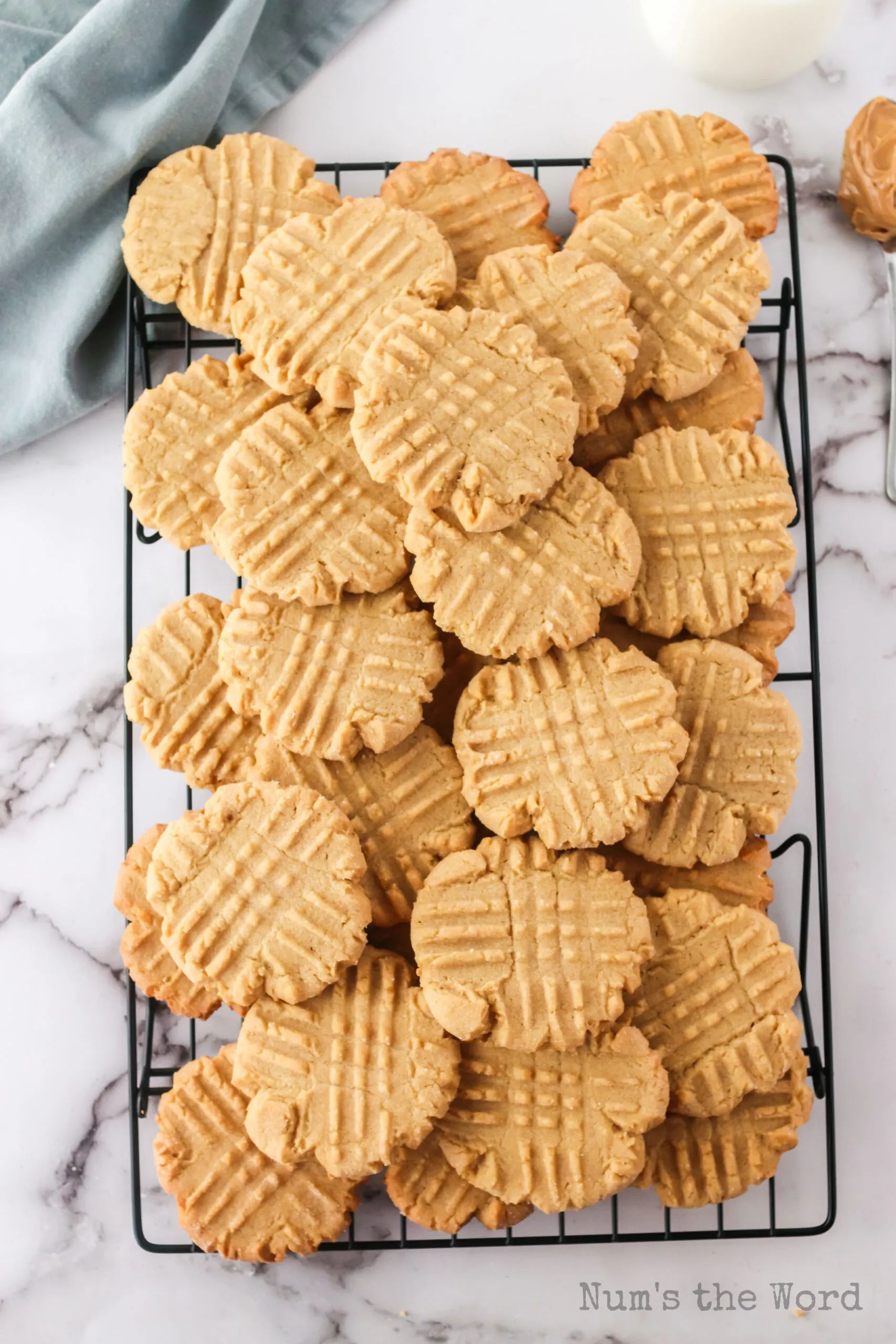 zoomed out image taken from the top looking down of baked cookies on a cooling rack