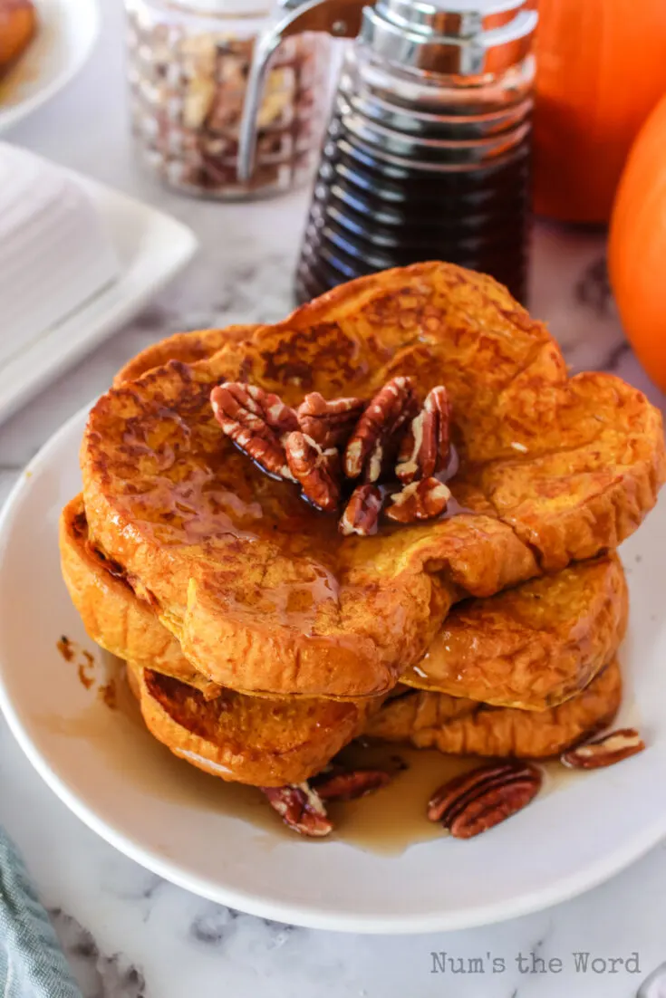 top side view of french toast on a plate ready to be eaten.