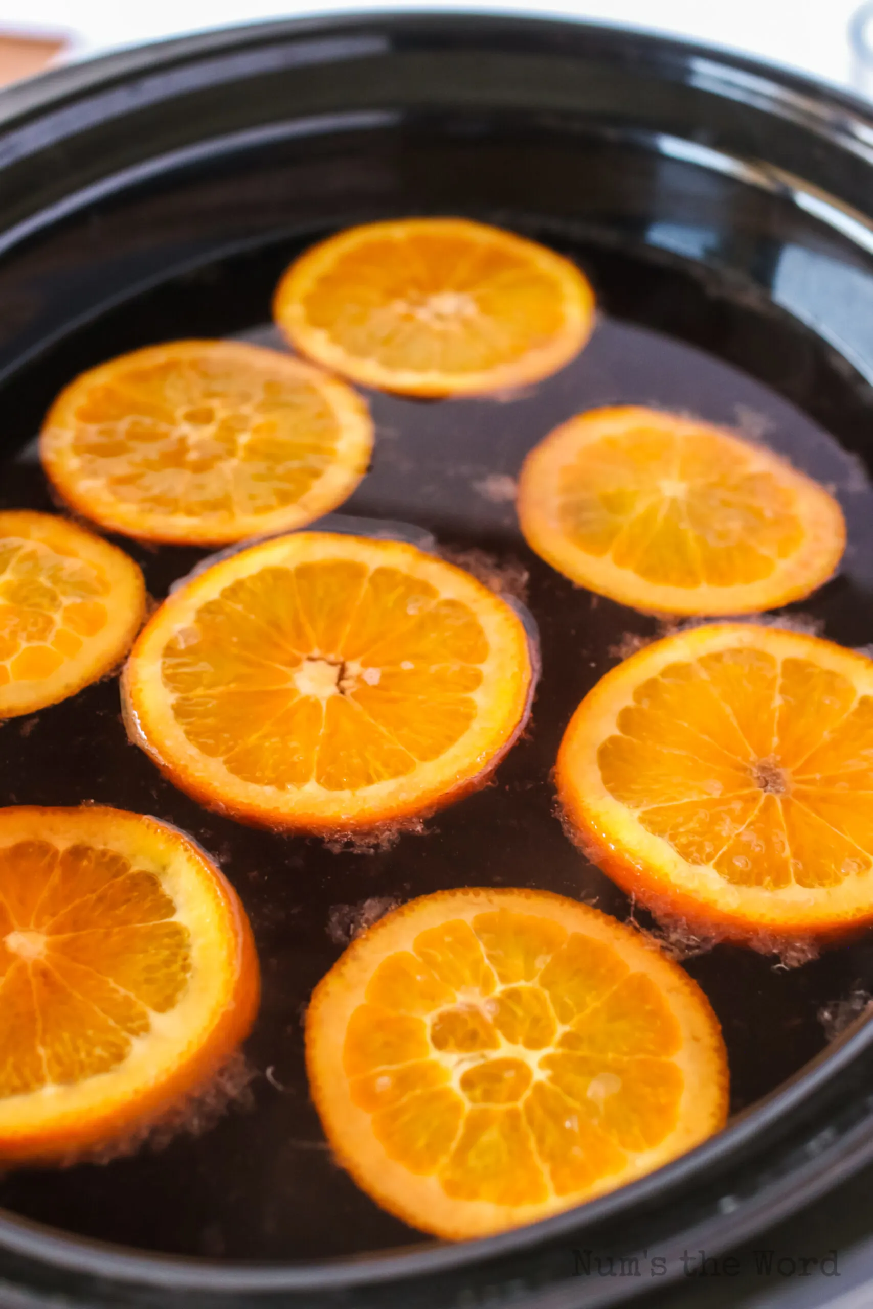 side angle of crock pot with orange slices