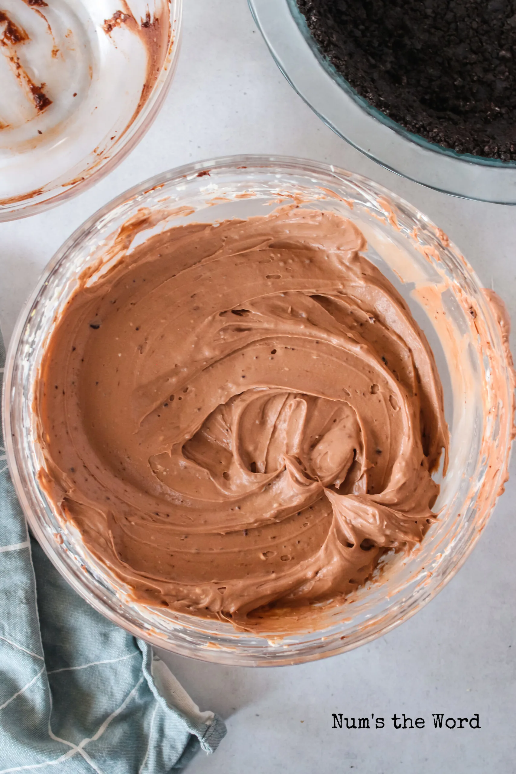 chocolate cheesecake mixture whipped up and ready to pour into oreo pie crust