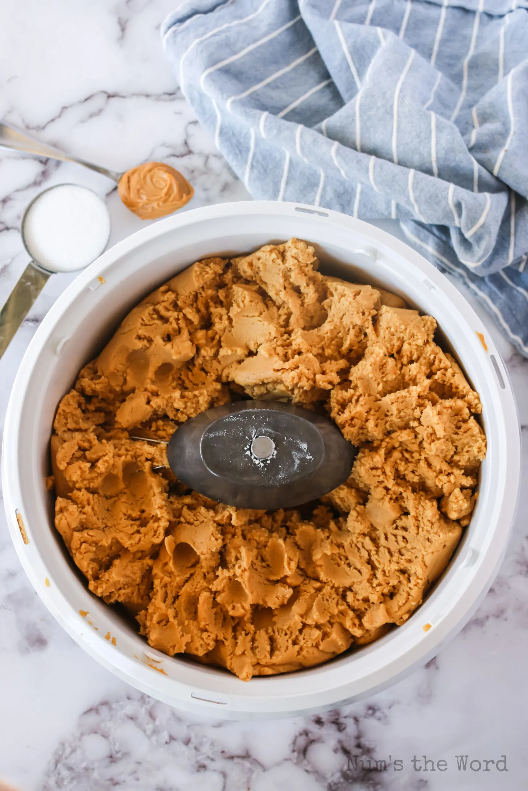 peanut butter and caramel bit cookie dough in mixer