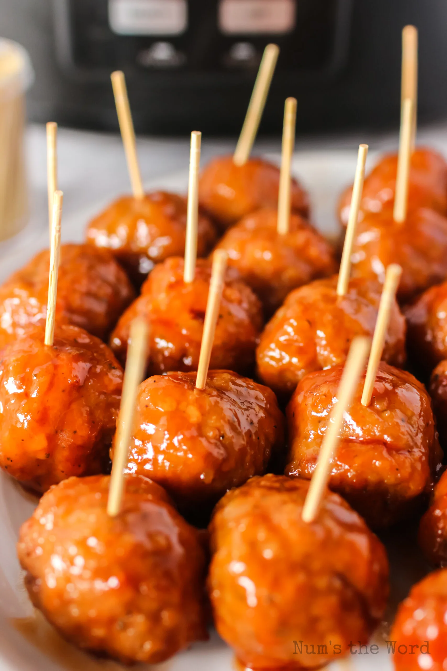 zoomed in image of meatballs with toothpicks