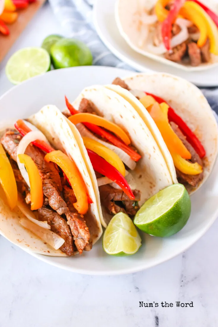 3 fajitas in flour tortillas