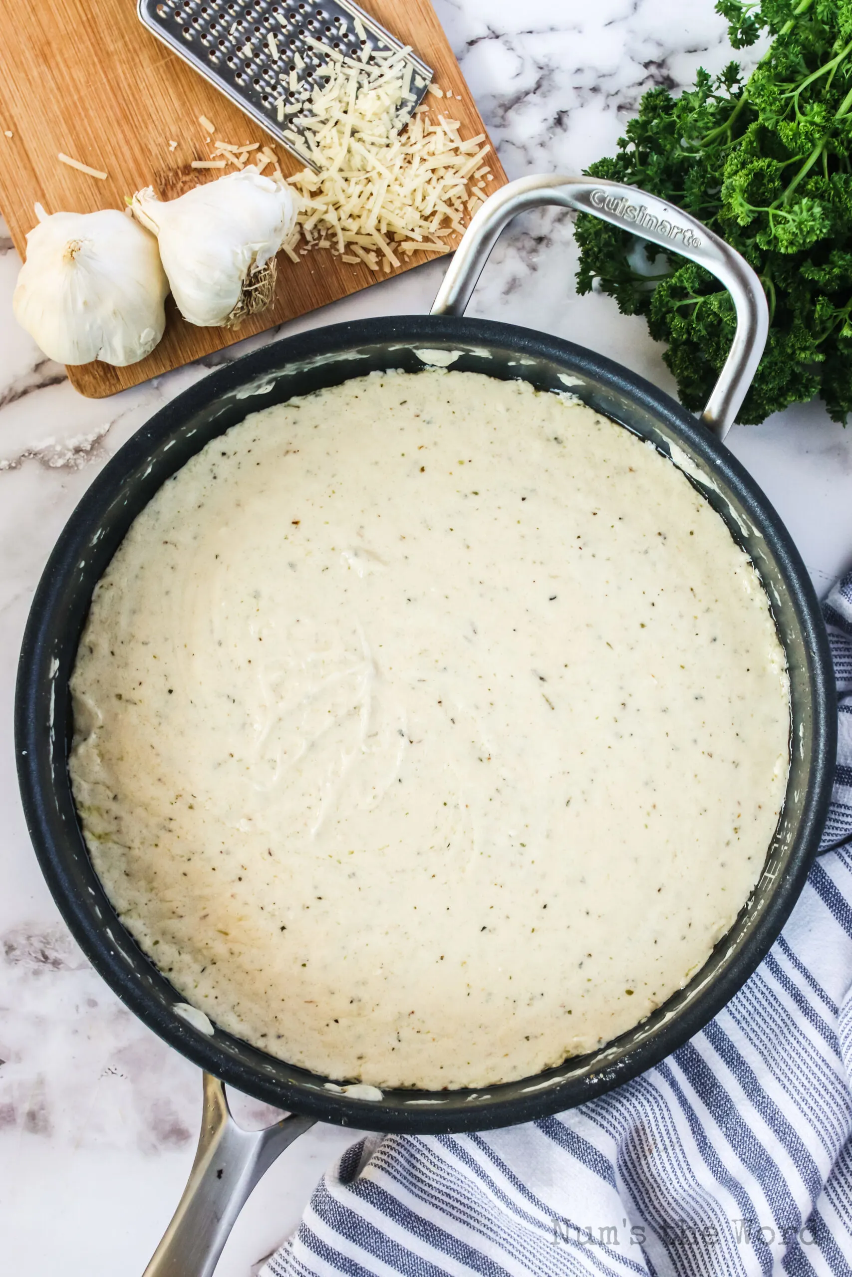 flour, chicken broth, half and half, onion powder, mustard powder, pepper, basil, oregano, parsley, parmesan cheese added to butter mixture.