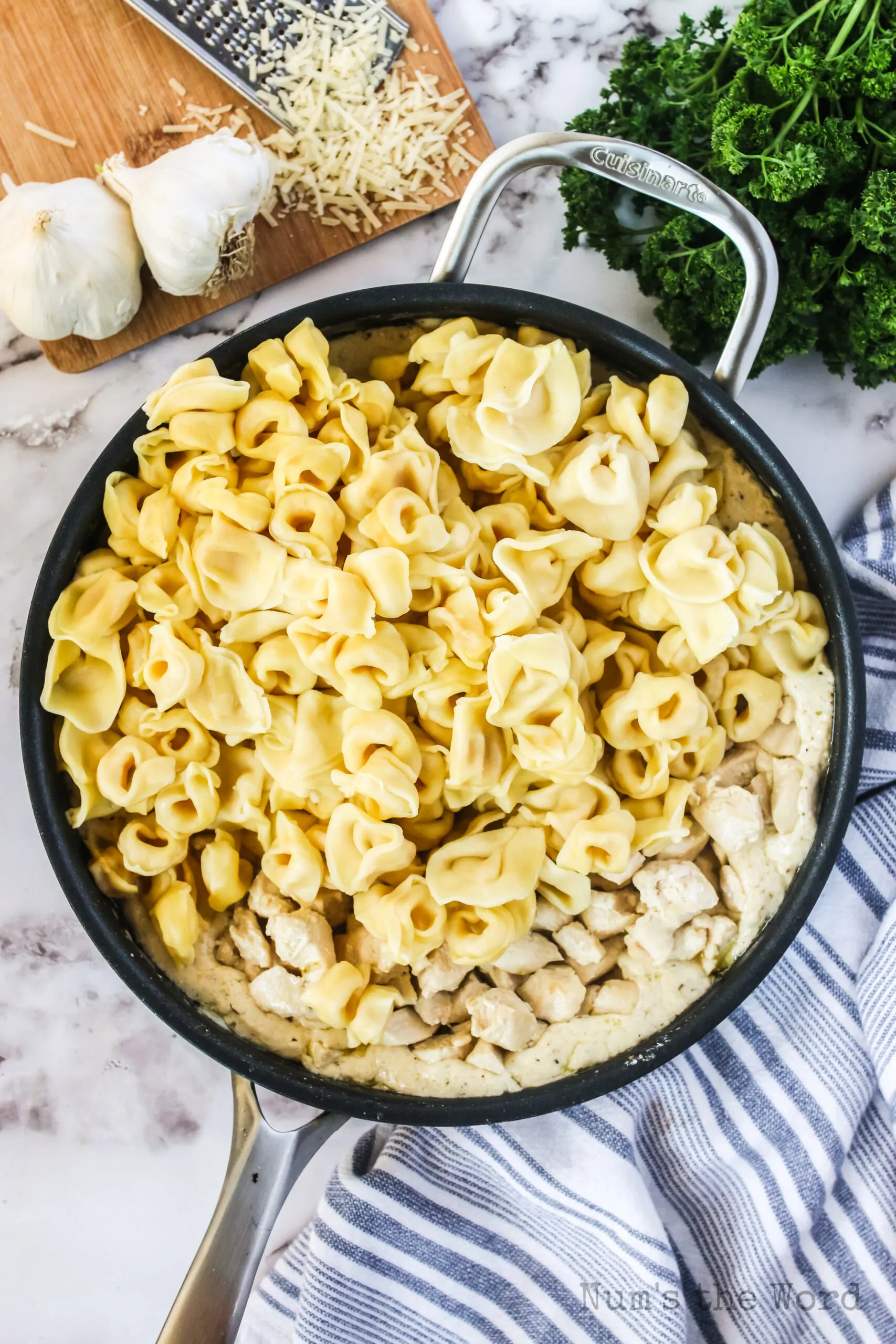 cooked tortellini added to alfredo mixture