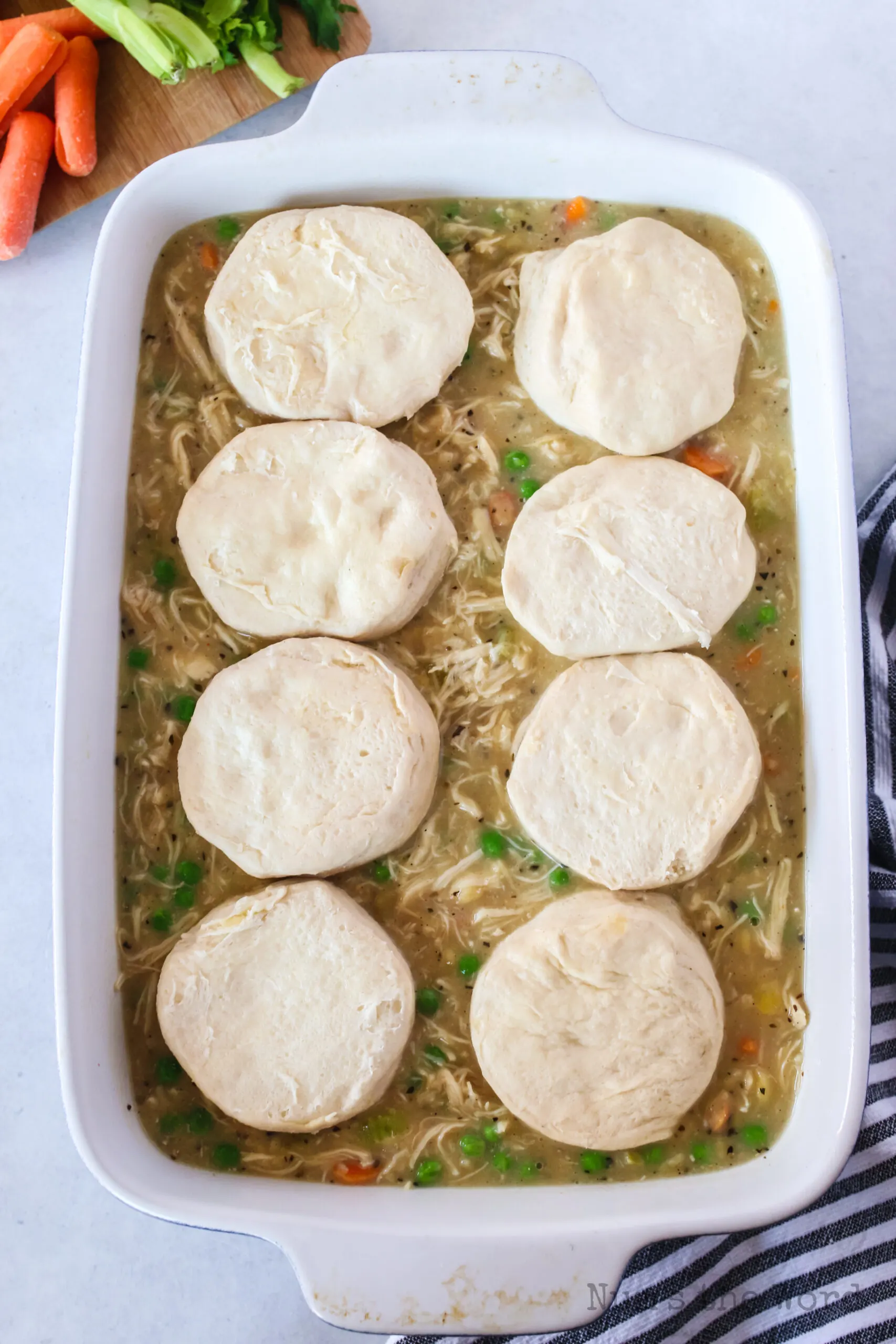 canned biscuits placed on top of chicken gravy mixture