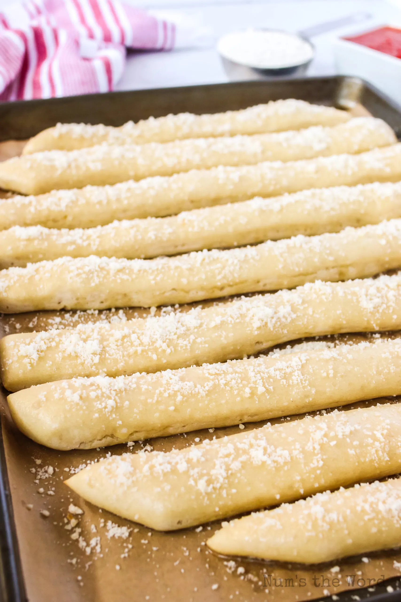 fresh baked crazy bread from oven with butter and cheese on top