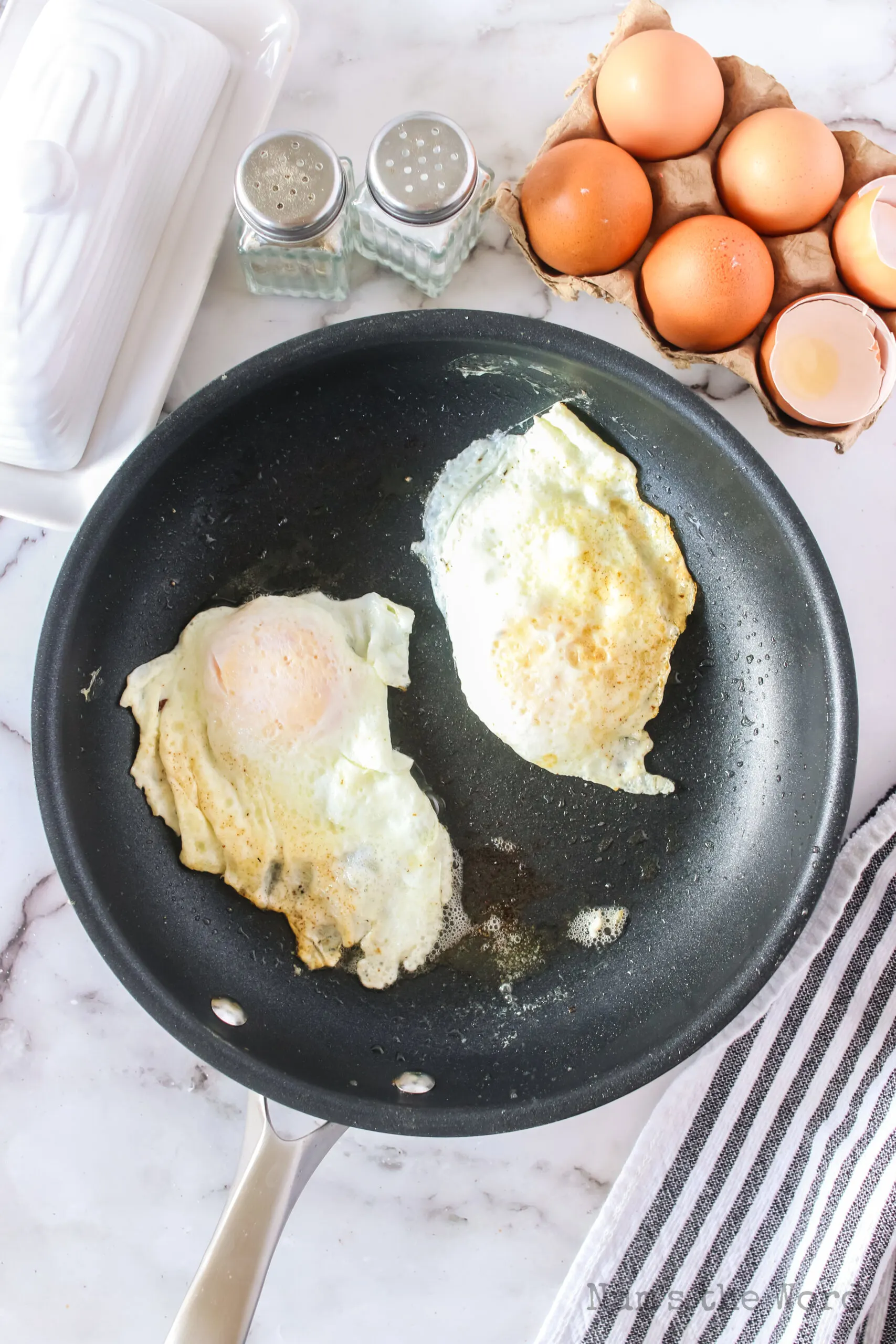 over easy eggs flipped in pan