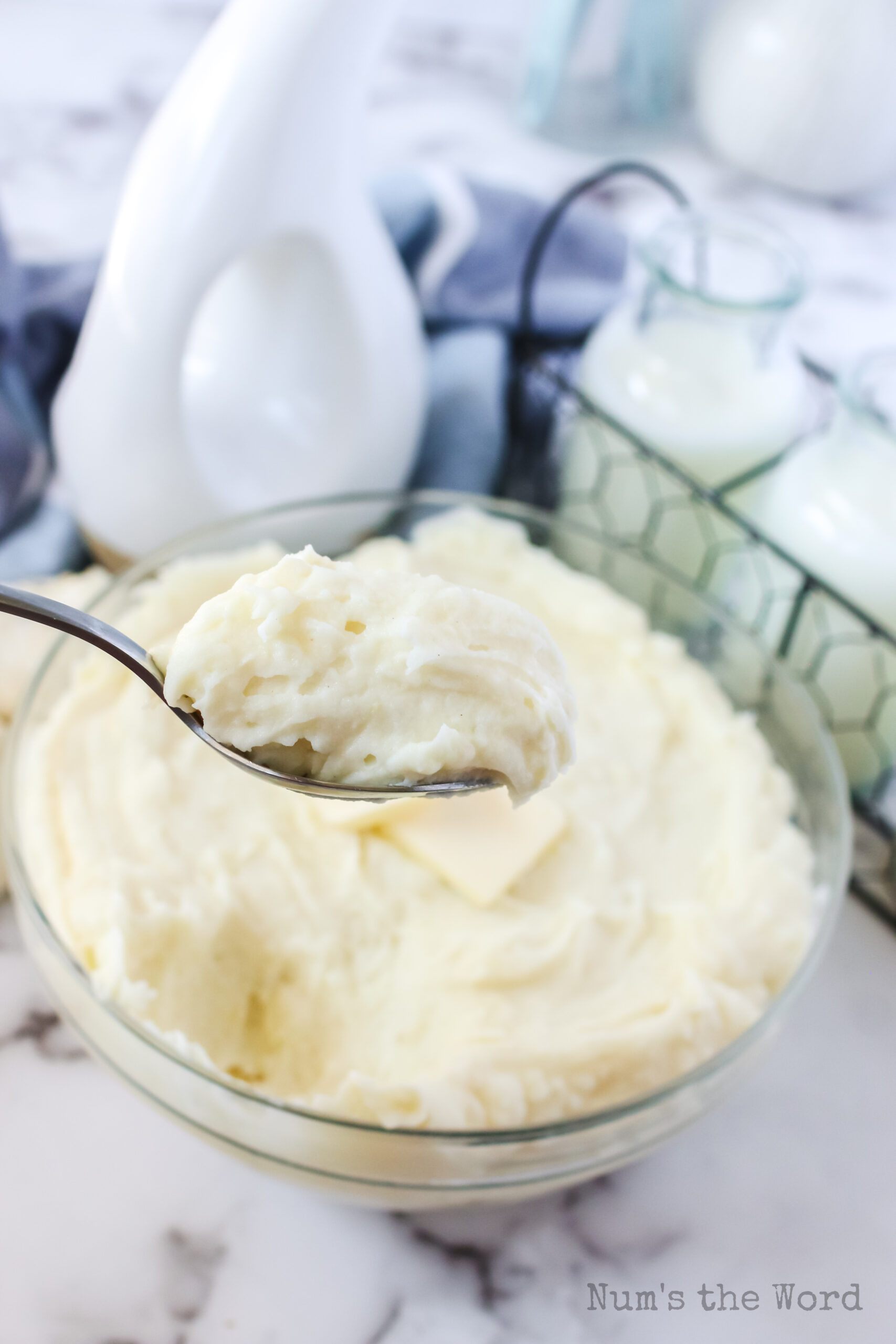 spoon scooping out a portion of homemade garlic mashed potatoes to serve
