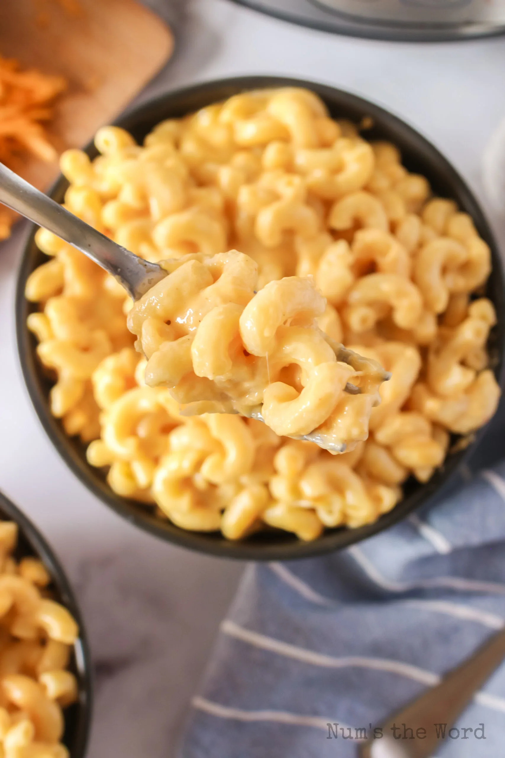 bowl of macaroni and cheese with a fork in it