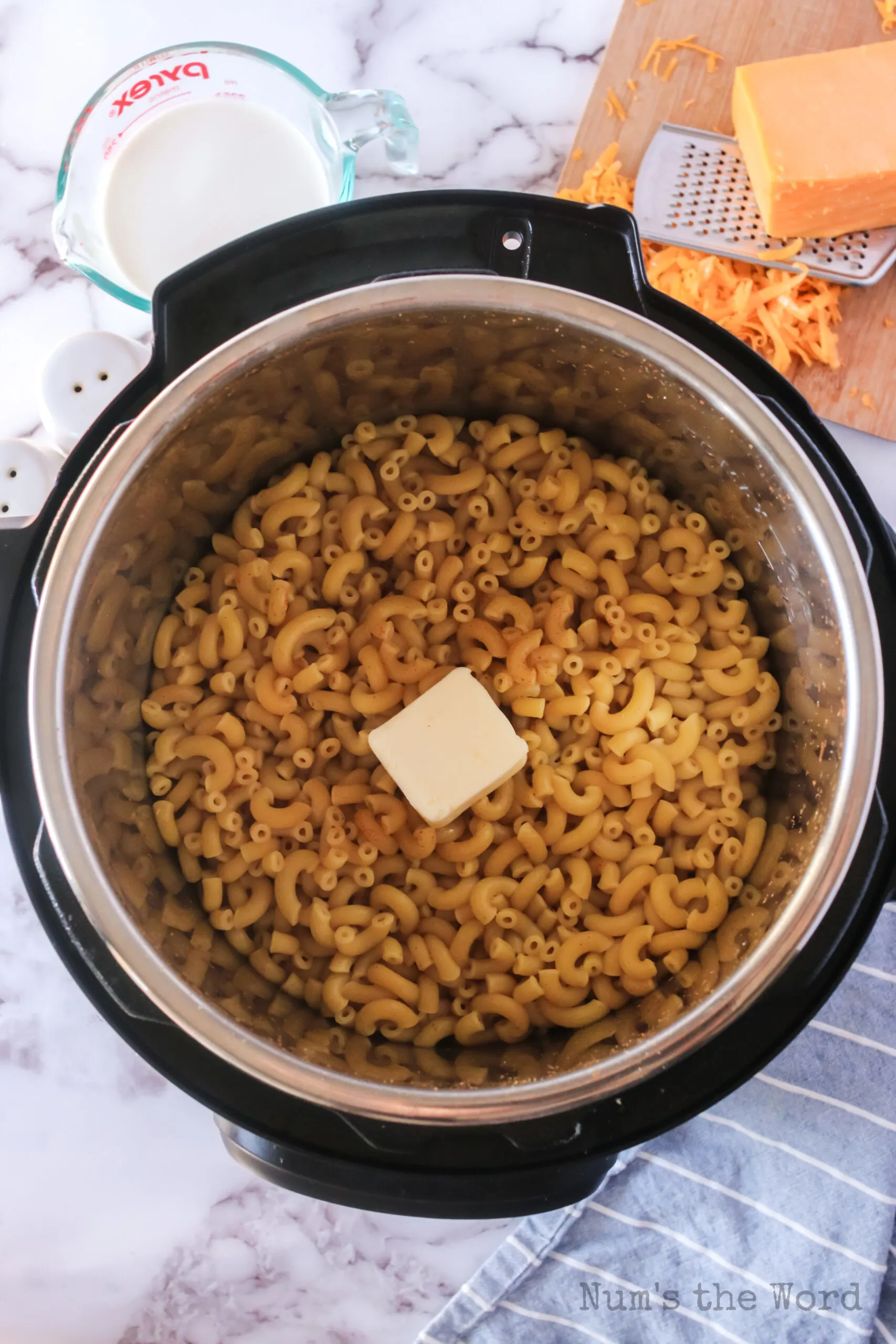 elbow macaroni noodles cooked with a pat of butter added on top