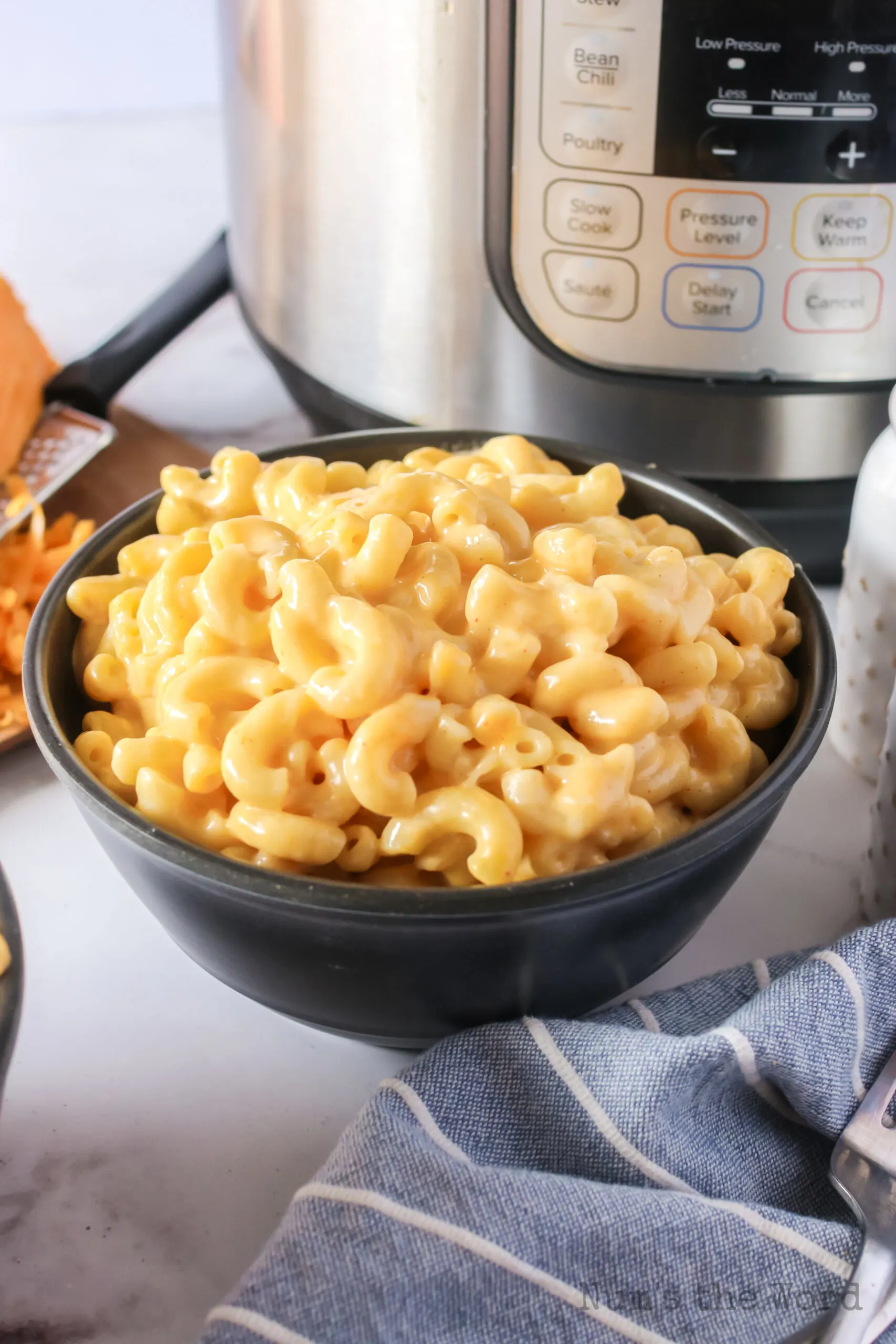 side view of macaroni and cheese in a bowl ready to eat