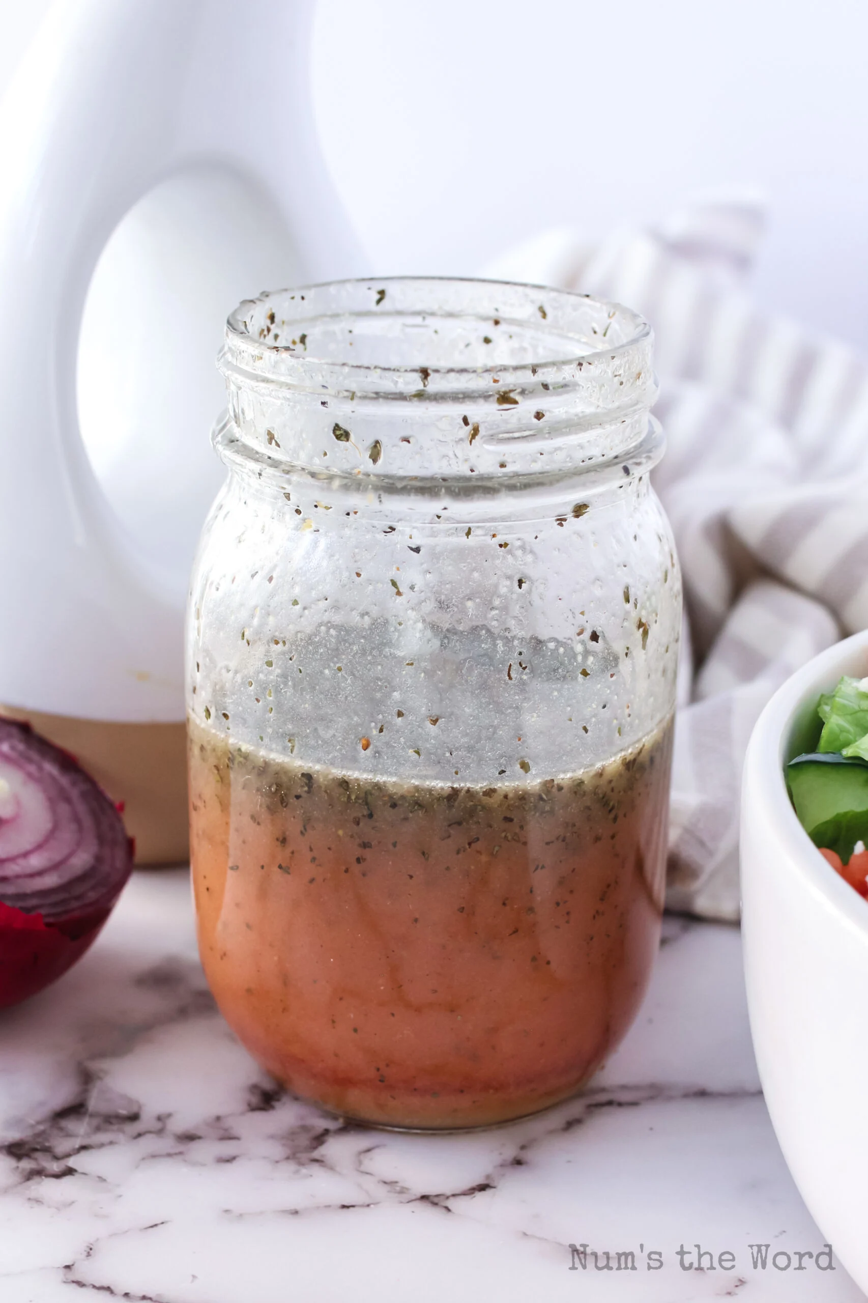 salad dressing ingredients all into a glass jar unmixed