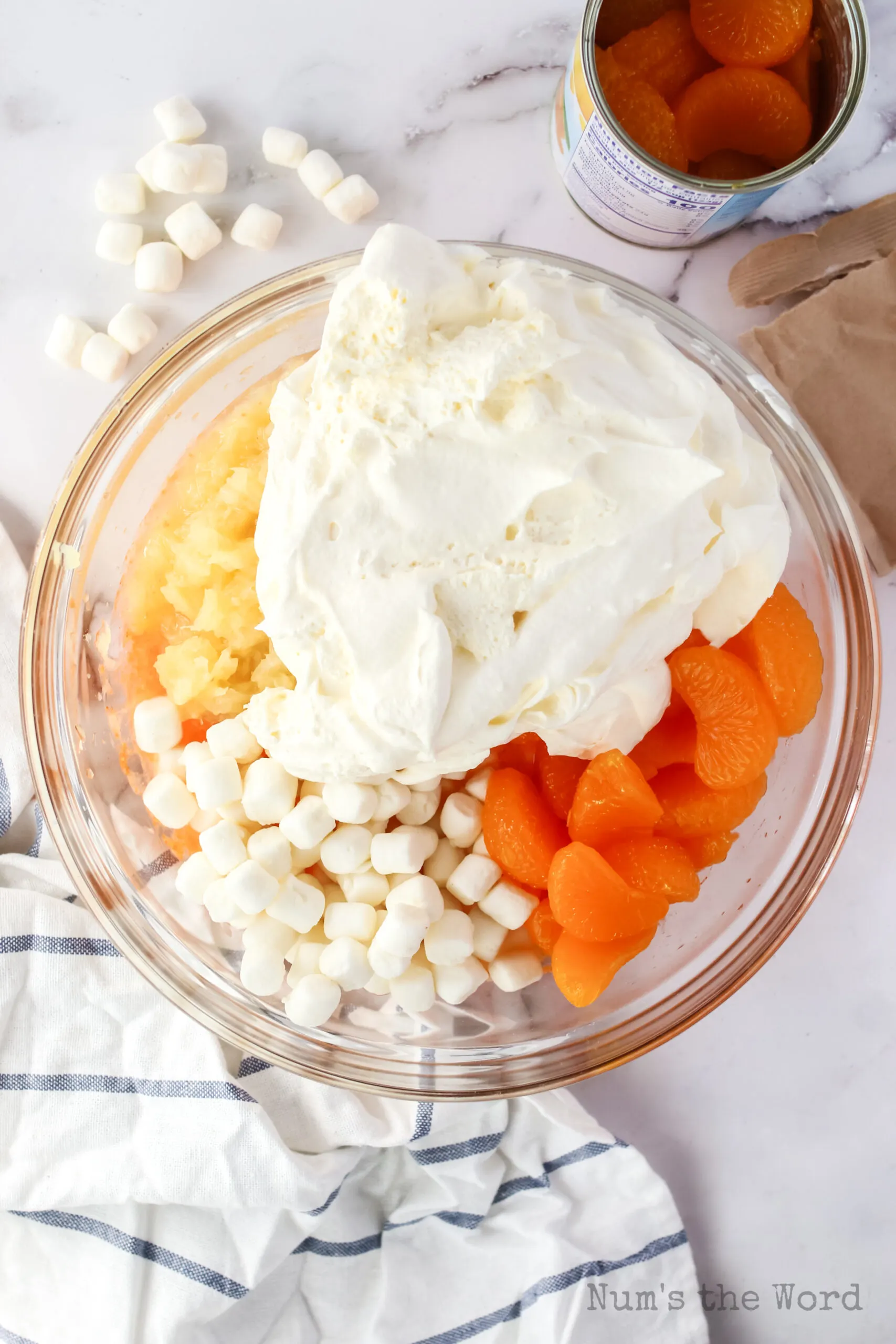 pineapple, marshmallows, orange and whipped cream all added to jello mixture