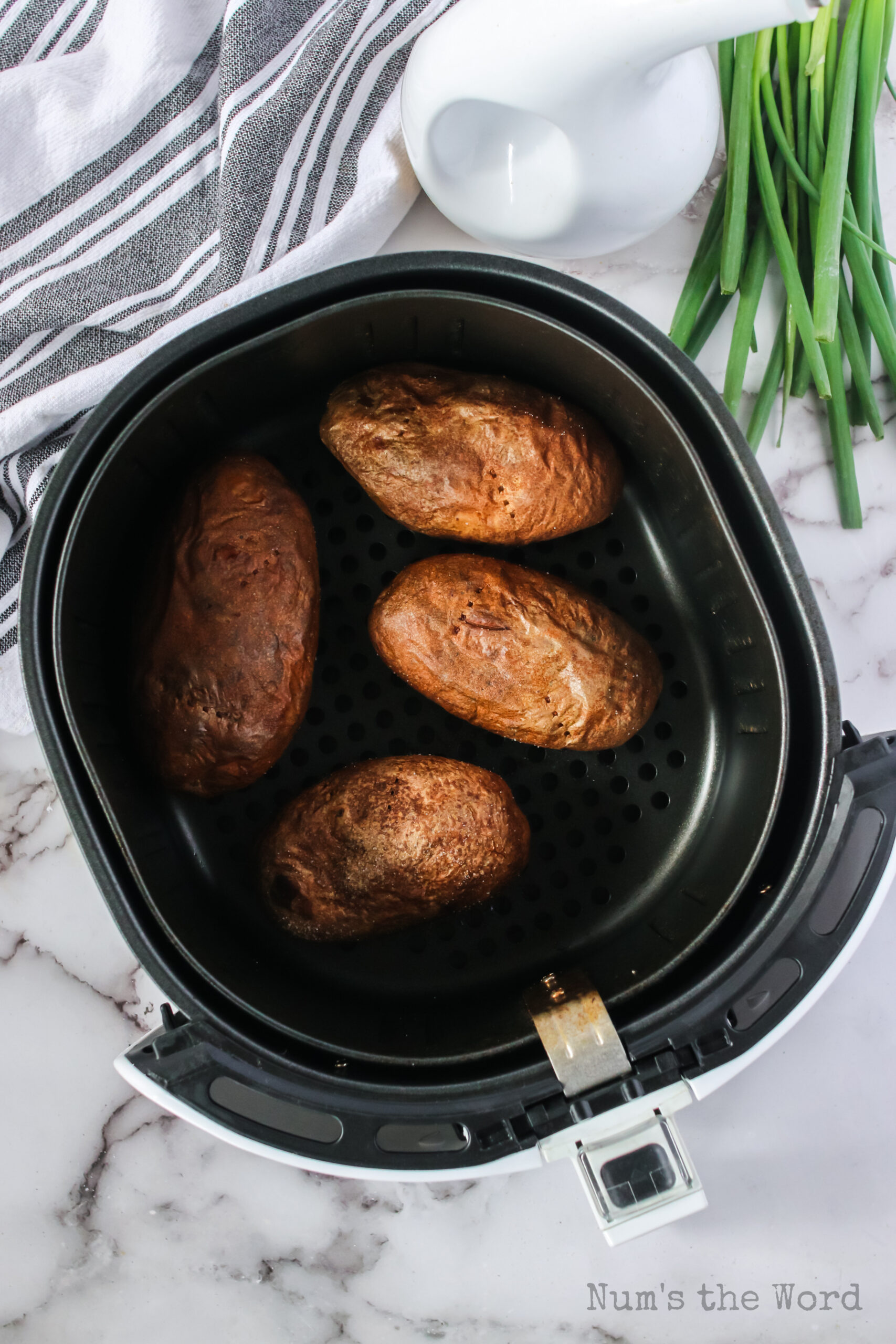 baked potatoes in air fryer ready to fill and serve