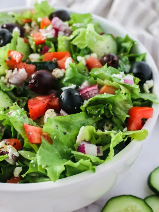 zoomed in side view of salad tossed and ready to eat