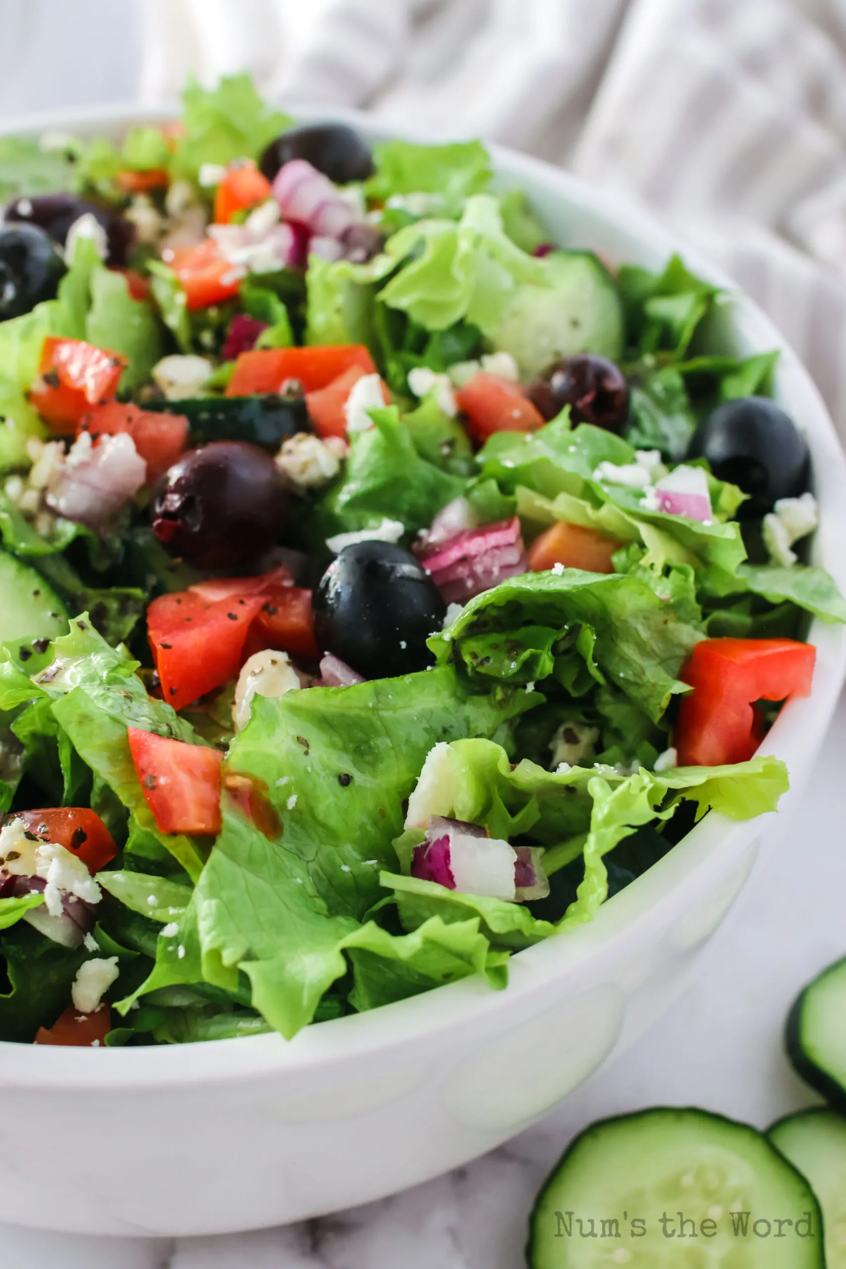 zoomed in side view of salad tossed and ready to eat