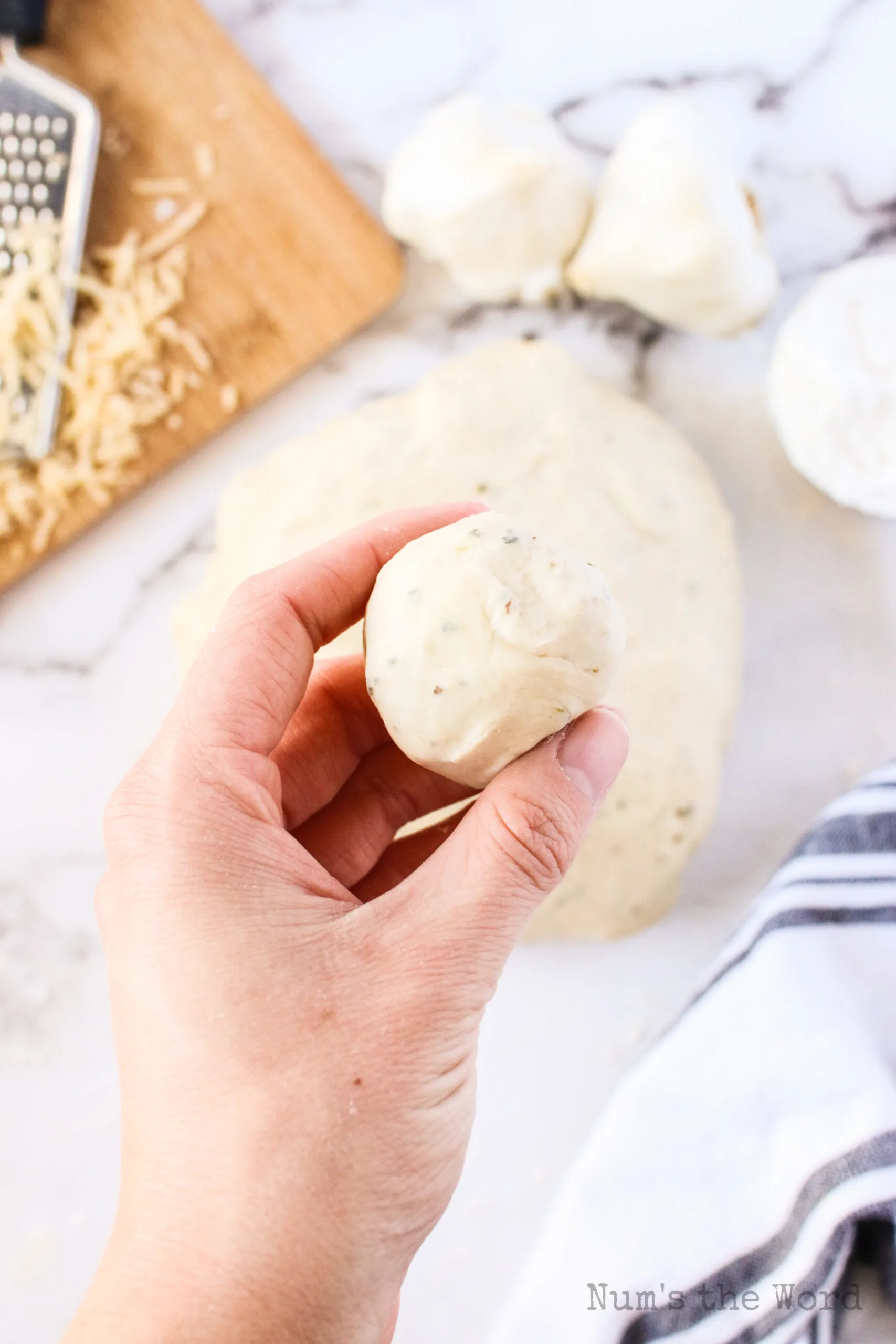 a golf ball size of dough ready to roll out for knots